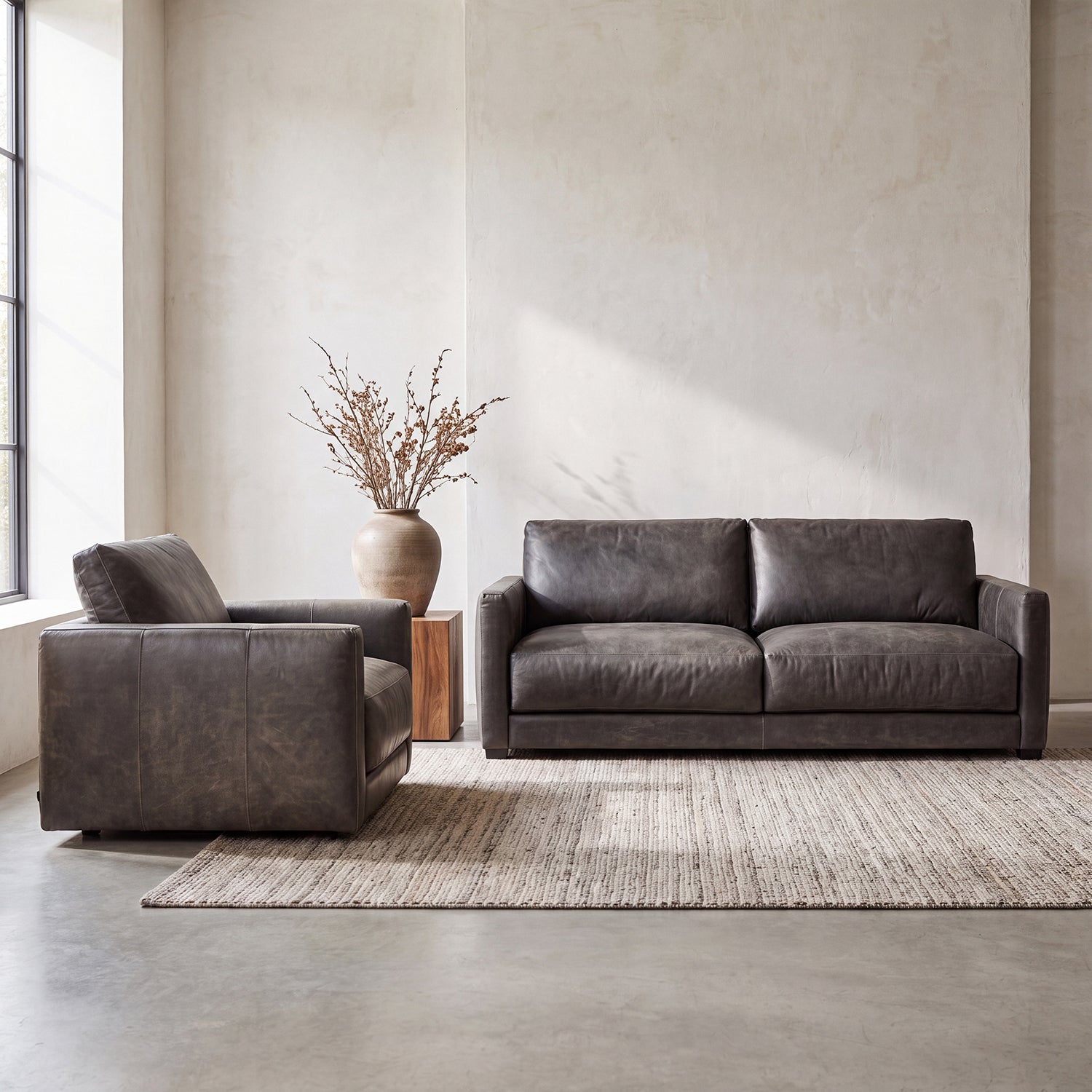 One-only Remington Cowhide Sofa & Swivel Chair Set in top-grain leather. Retail value $12,098, special bundle price $7,999. First come, first served.