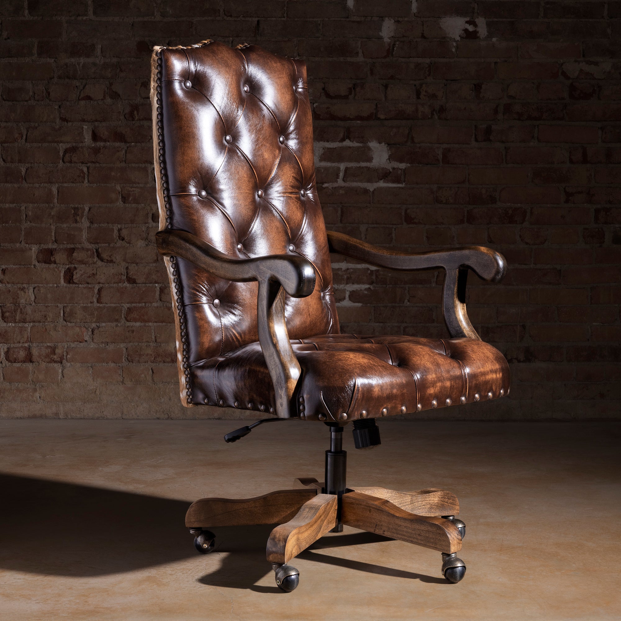 Tufted top-grain leather Western desk chair with axis hide back and casters