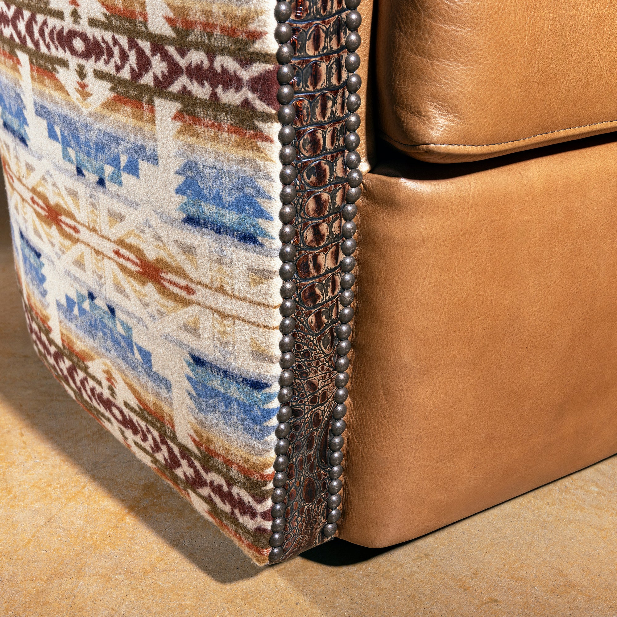 Close-up of Pendleton wool pattern in blue, rust, and cream on Western swivel chair