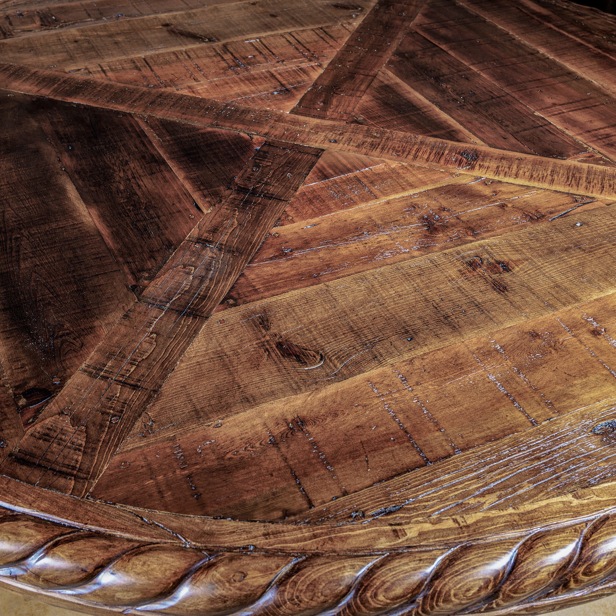 Close-up of rope-carved trim on rustic round dining table