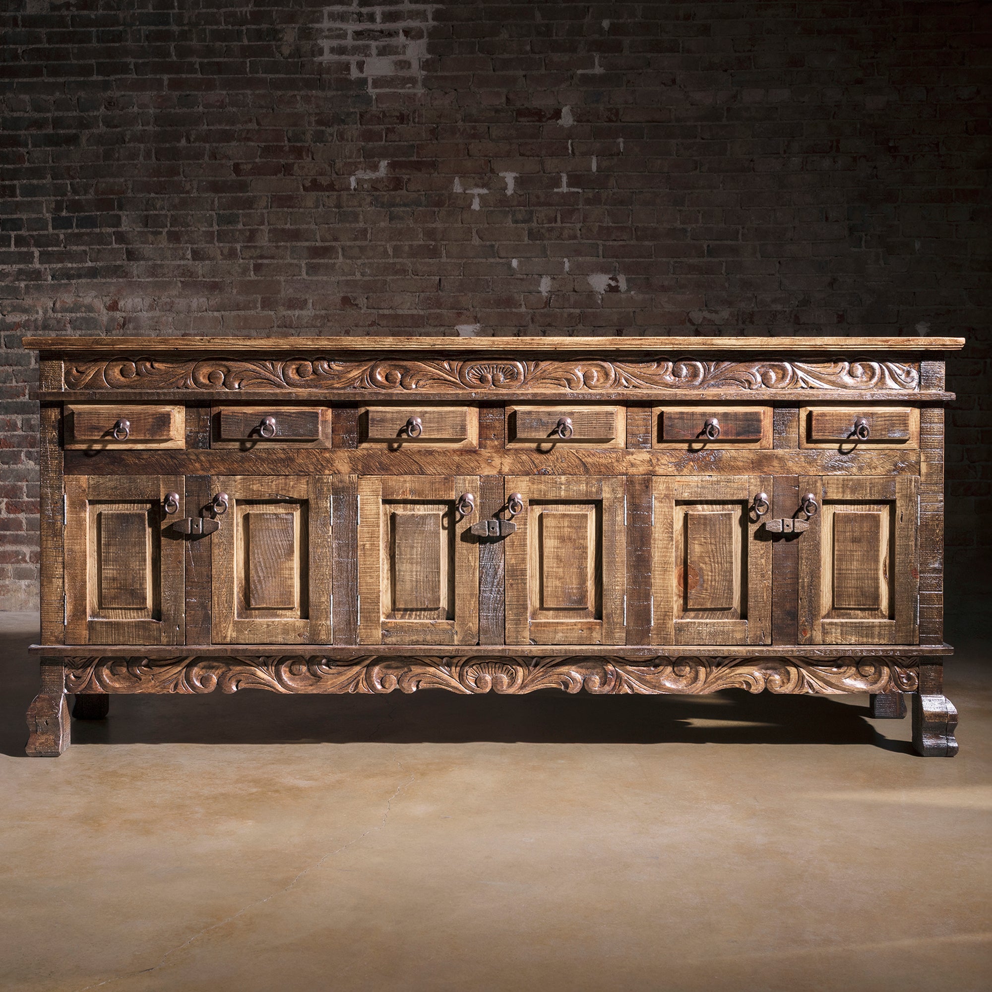 Front view of Sagebrush Scrollwork Buffet with drawers and cabinet storage