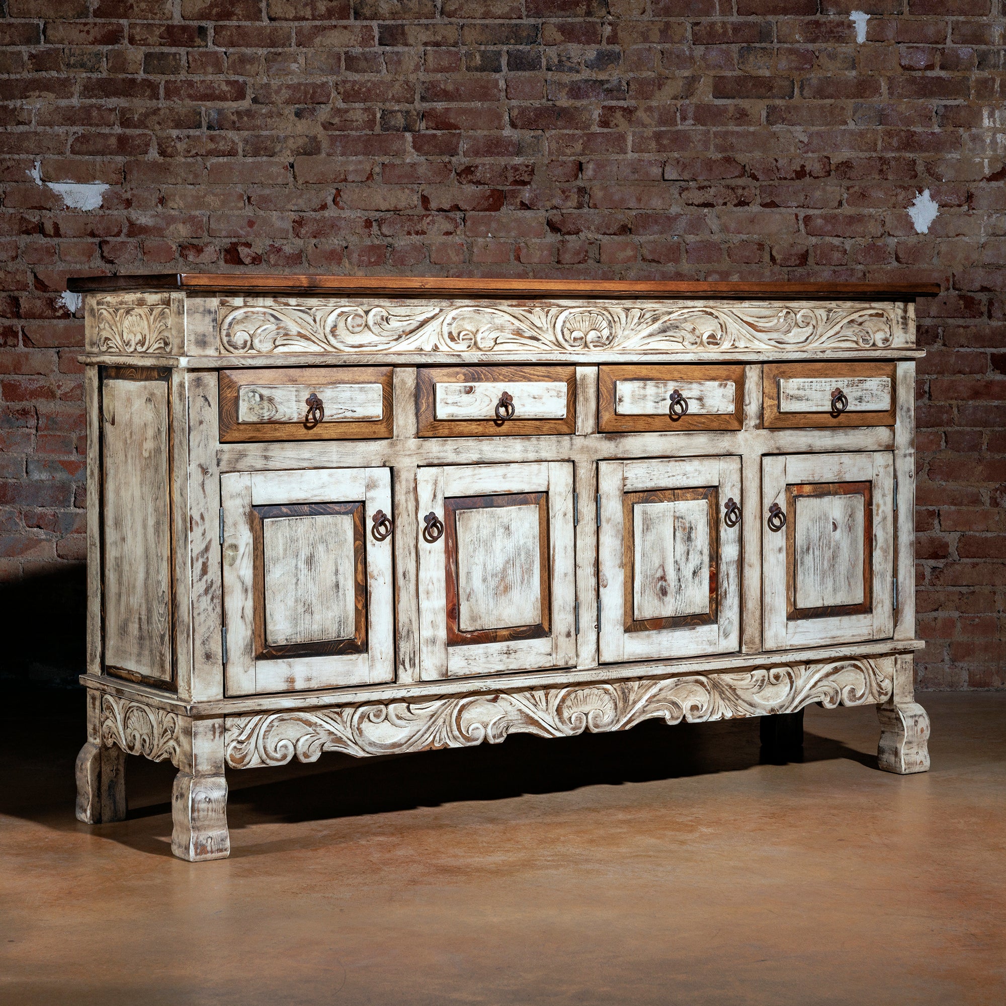 Angled side view of the Santa Ynez console highlighting carved legs and paneling