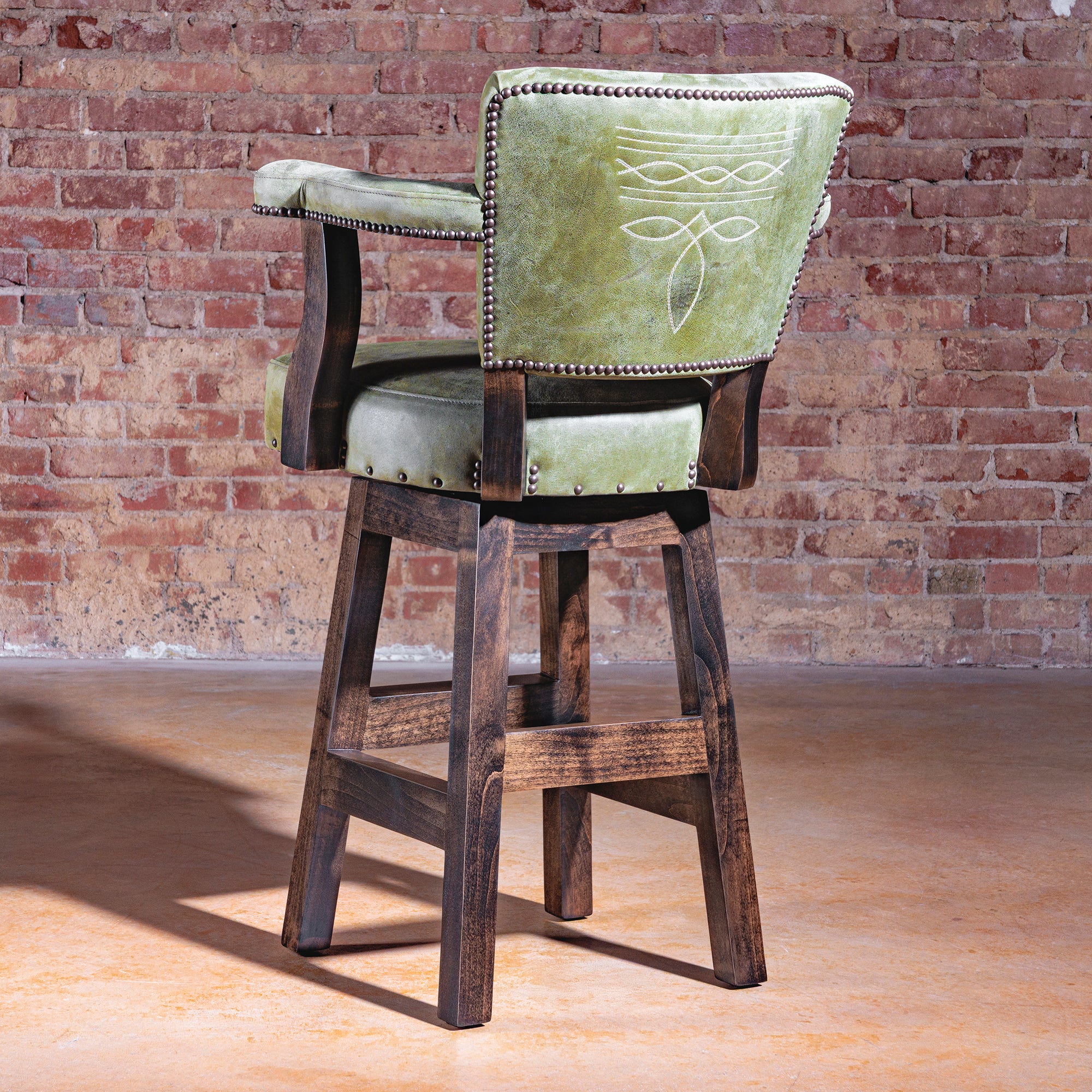 Rear view of Sonora Verde Bar Stool in green leather with boot-stitch detail and nailhead trim