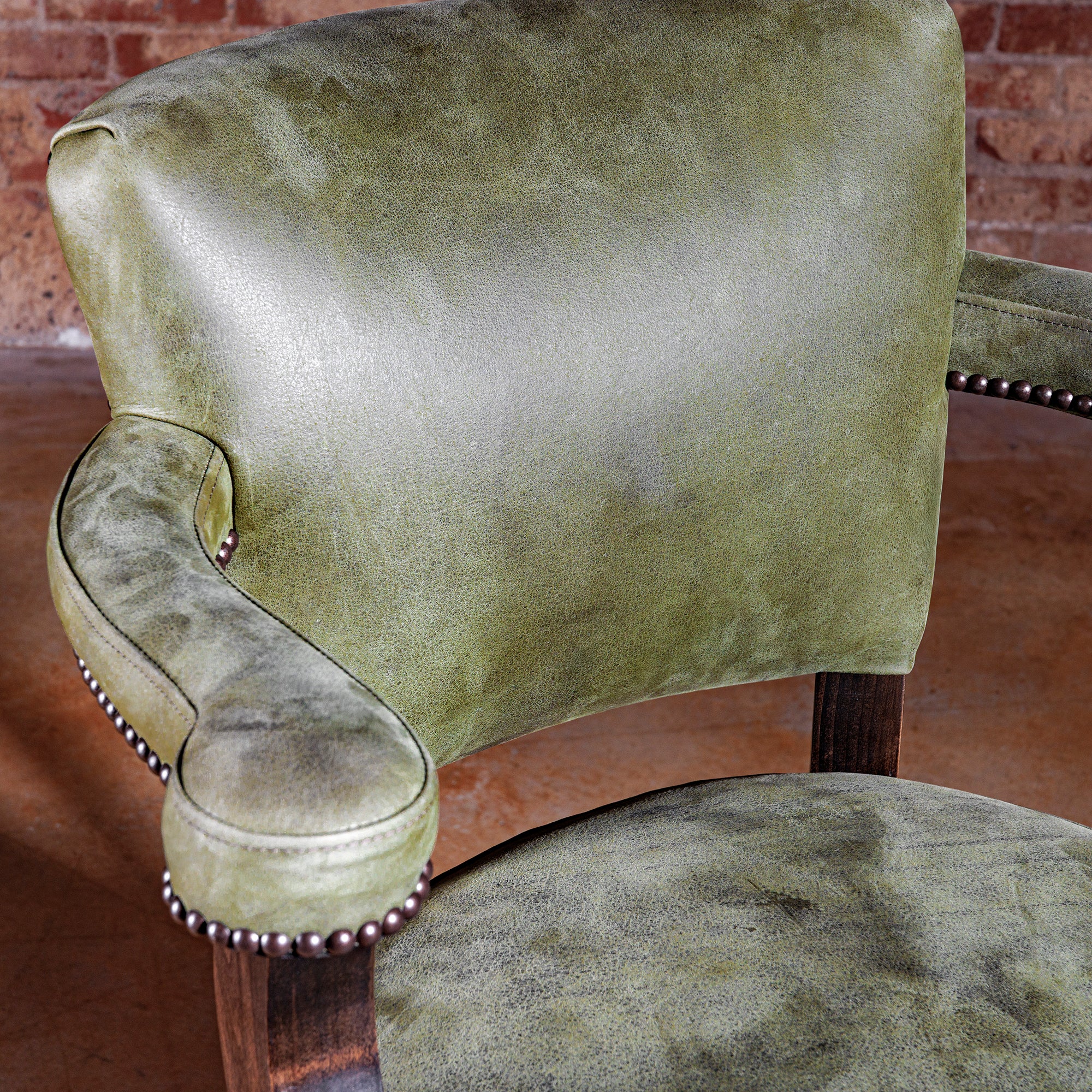 Close-up on sage-green leather backrest—Sonora Verde