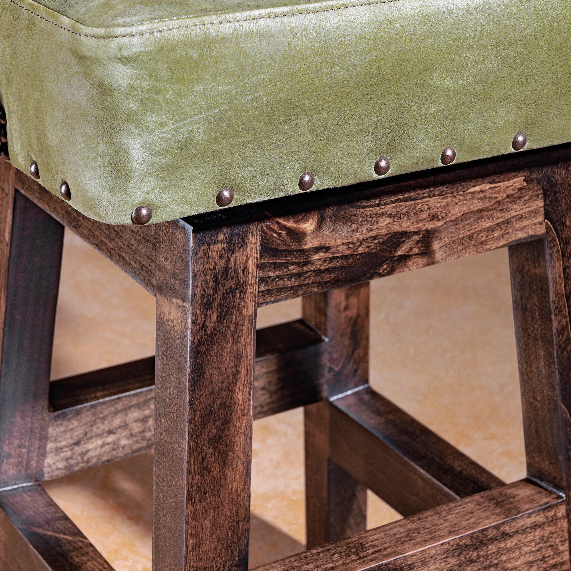 Solid alder wood frame detail of Sonora Verde Western bar stool