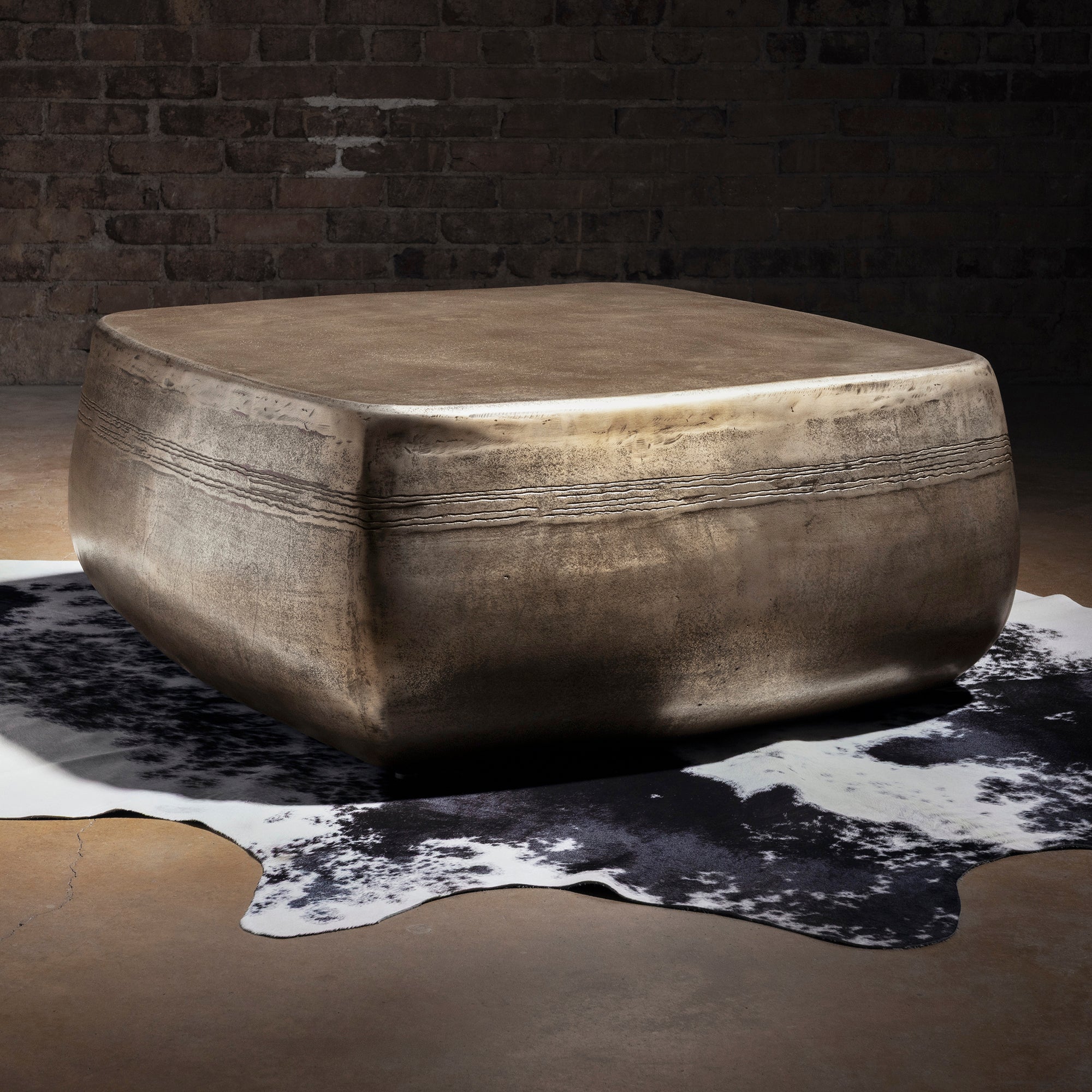 Sterling Range Forge Low Western Metal Coffee Table western coffee table styled on cowhide with rounded edges and hand-worked metal.
