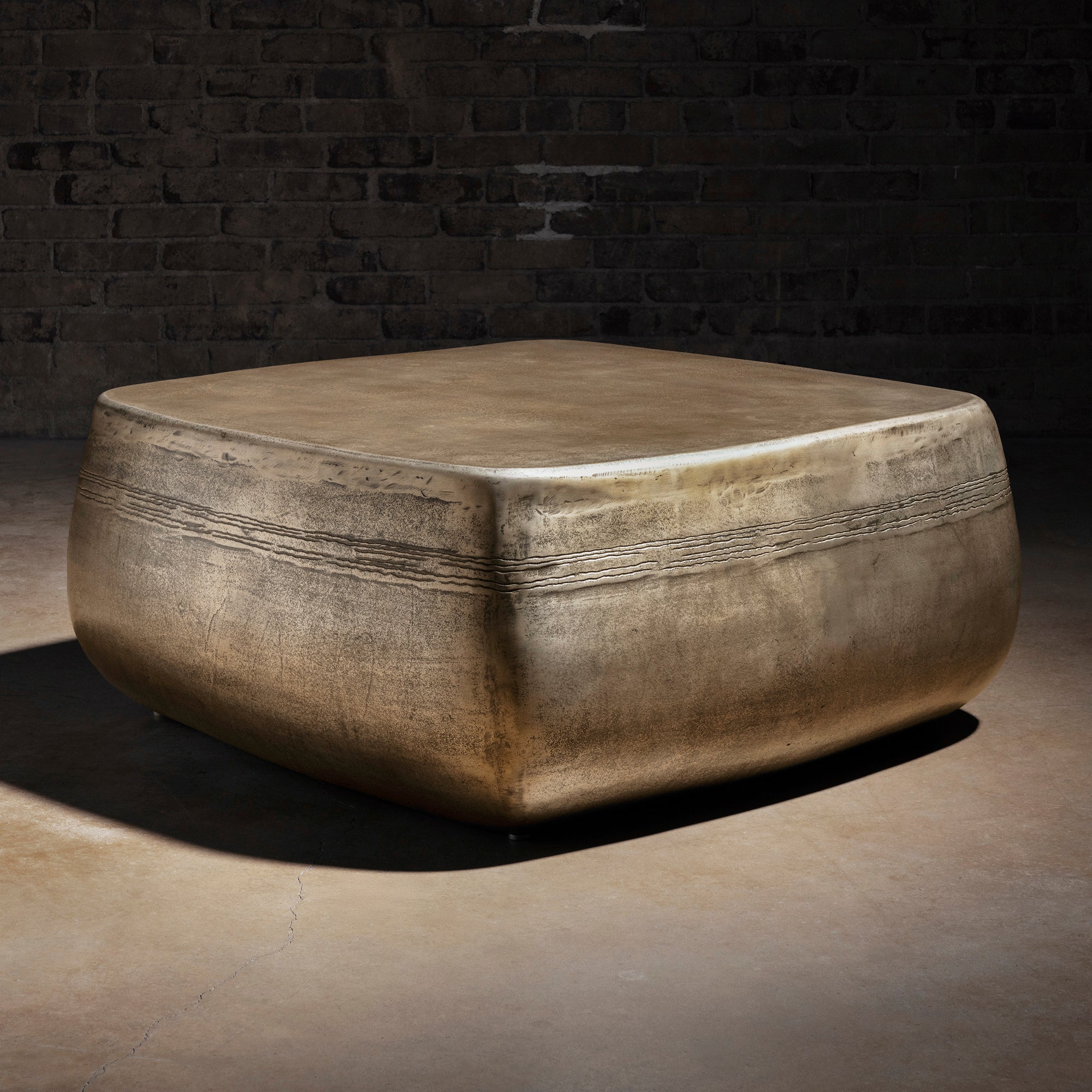 Sterling Range Forge Low Western Metal Coffee Table western coffee table with a low sculptural form, softened corners, and silver finish.
