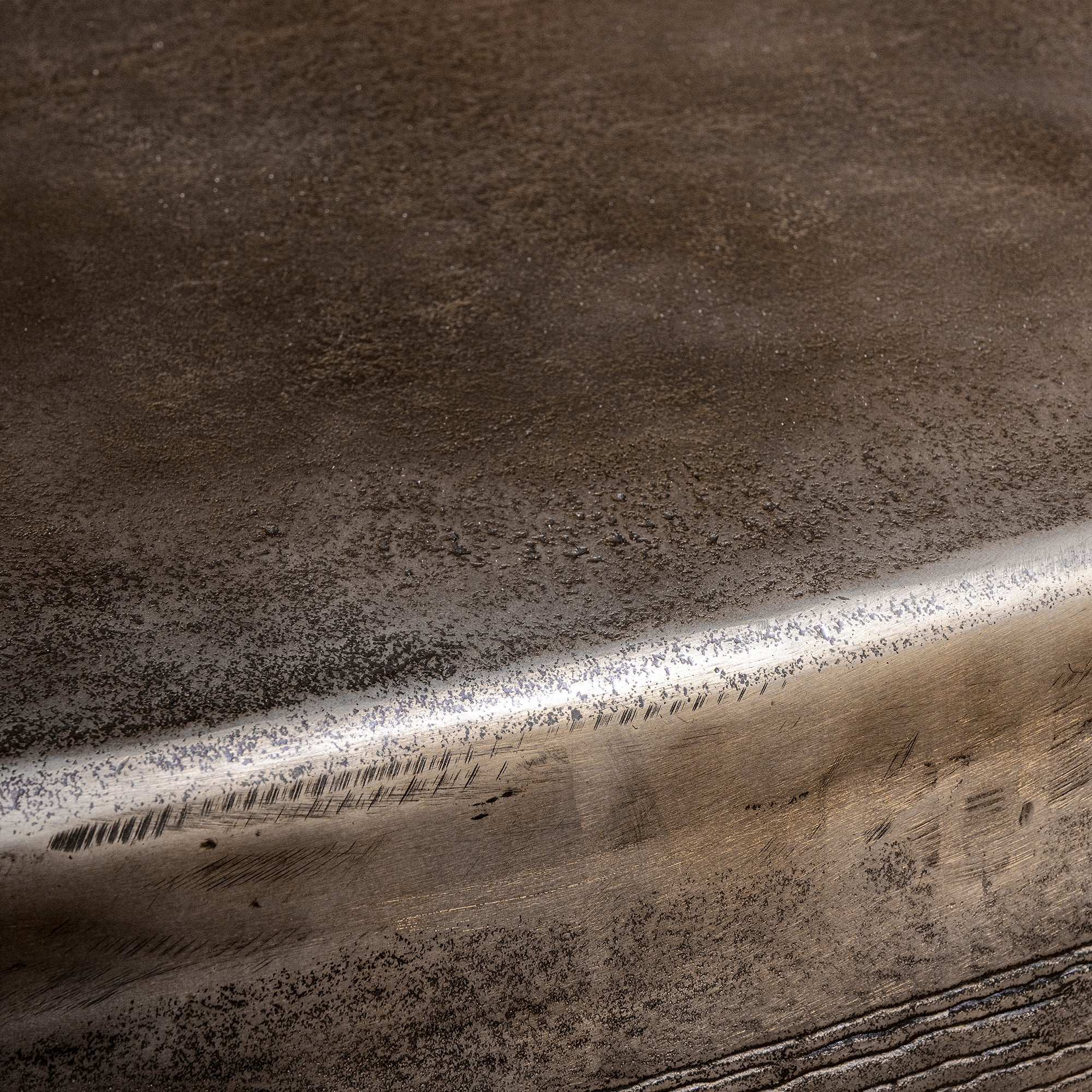 Sterling Range Forge Low Western Metal Coffee Table western coffee table close-up with forged banding, silver patina, and softened corner.