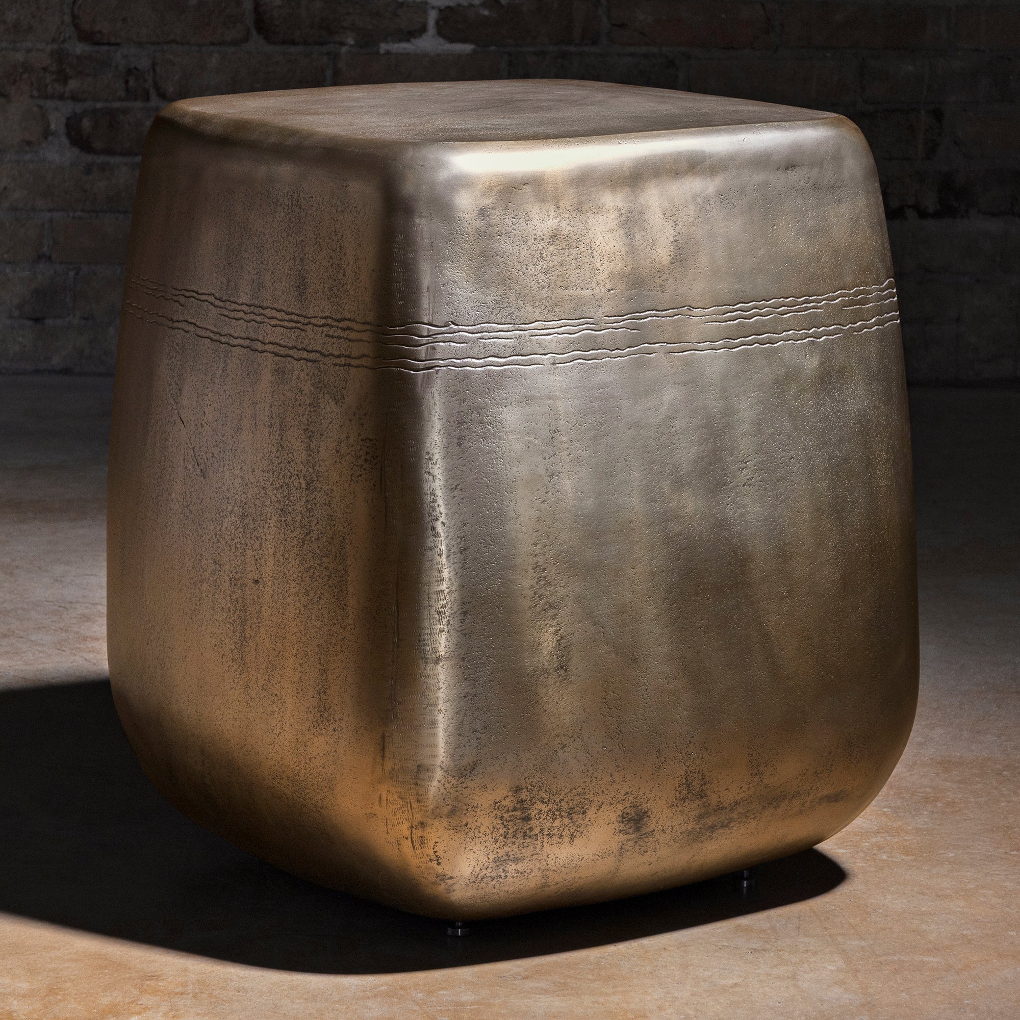 Sterling Spur Accent Table silver metal accent table with a rounded cube silhouette, burnished finish, and refined Western styling