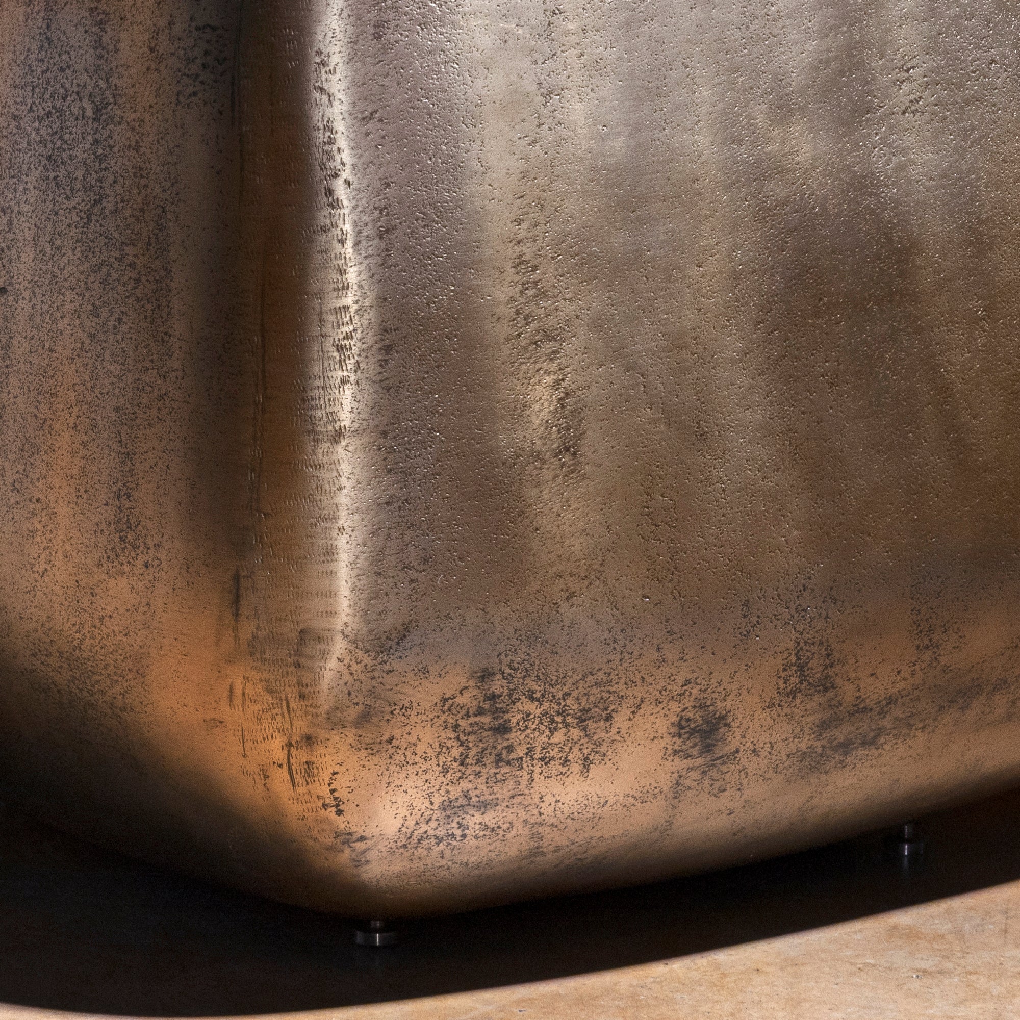 Sterling Spur Accent Table close-up of the silver metal accent table showing hand-textured finish, softened corners, and forged band detail