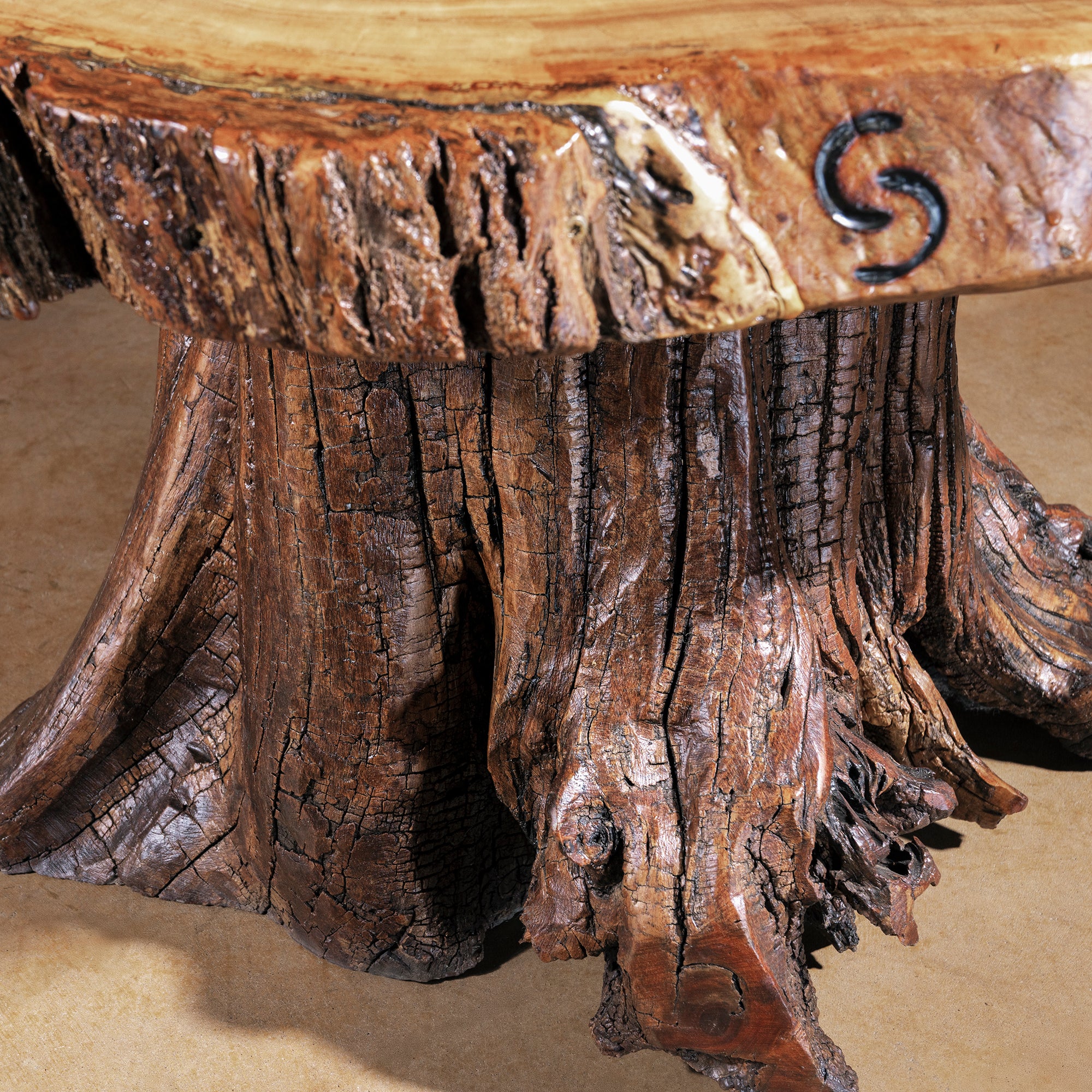 Root-formed pedestal base of Sundermill Rootstone Table with textured wood detail