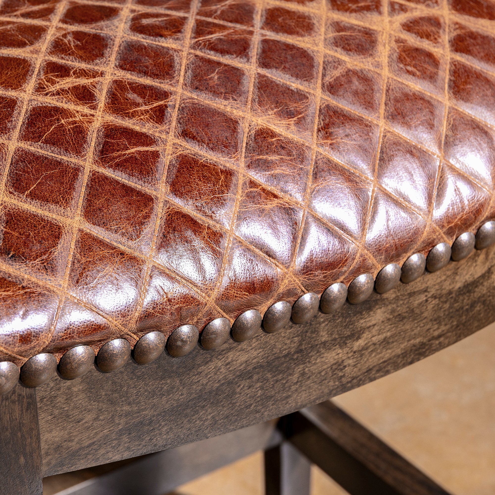 Tascosa Saddle Stool western leather bar stool with backless saddle seat, dark alder wood frame, and nailhead trim