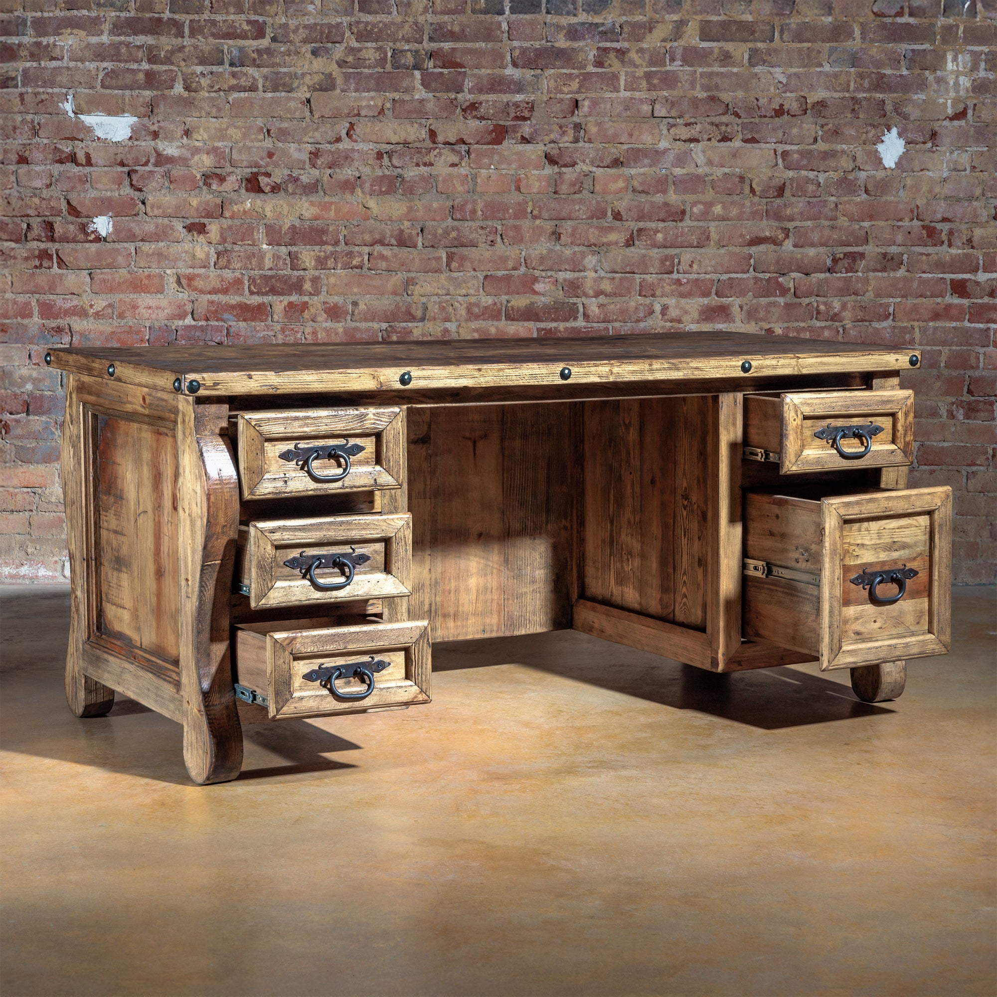 The Telluride Executive Desk with all drawers open, showcasing deep file drawer and hardware accents