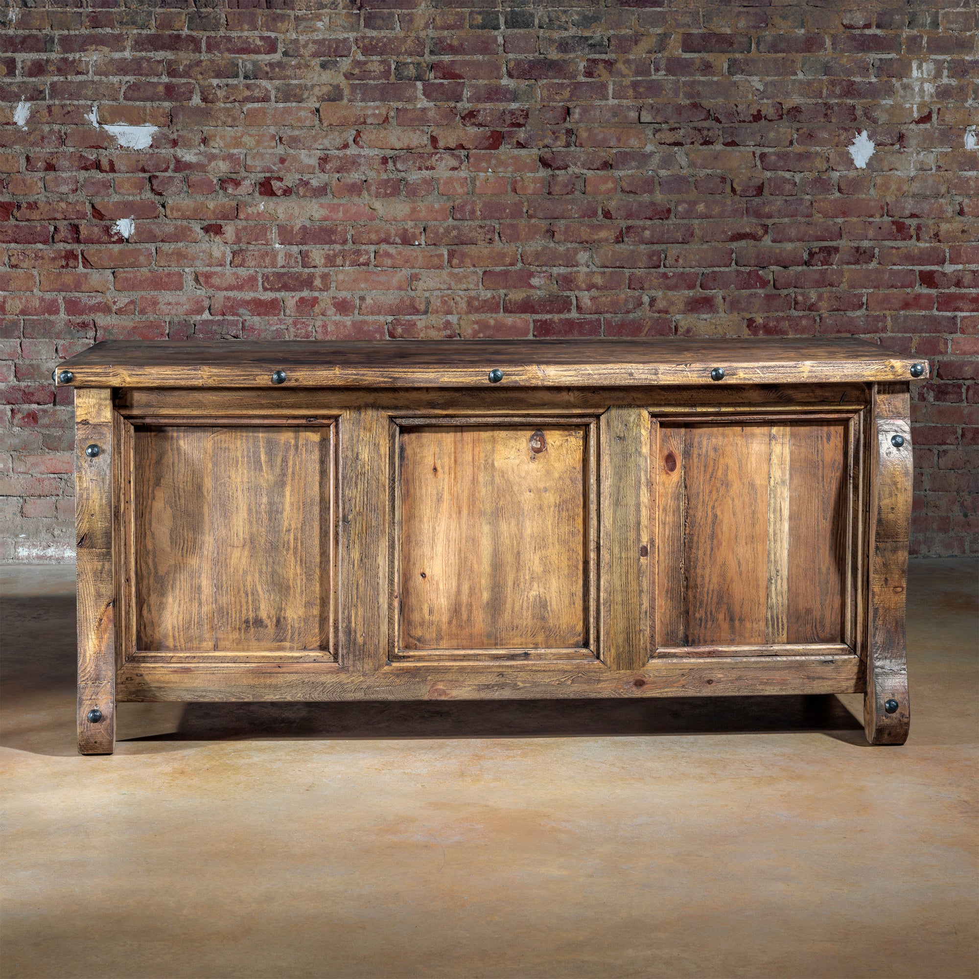 Front angle of The Telluride Executive Desk with serpentine legs and paneled front