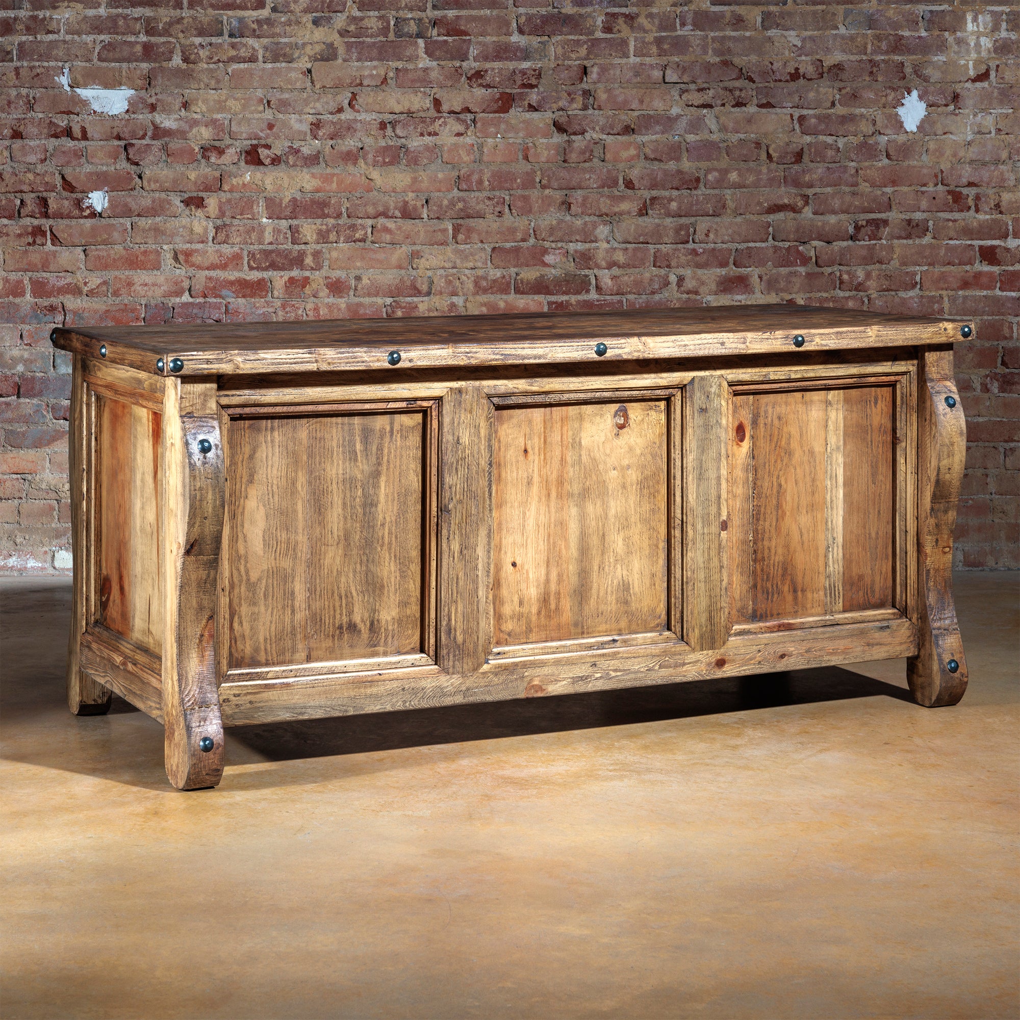 Hero image of The Telluride Executive Desk with drawers closed, showing rustic wood and iron detailing