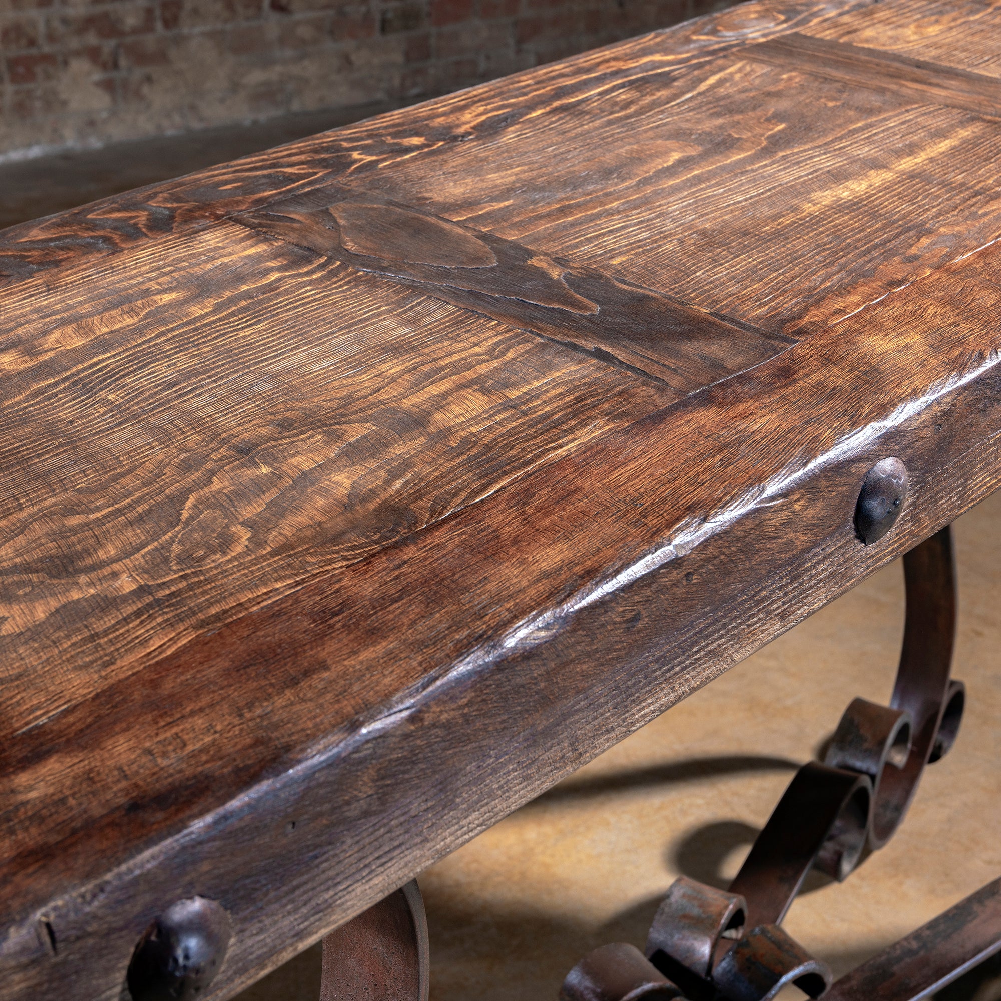 Distressed reclaimed wood top with rivet edge detailing – Into The West