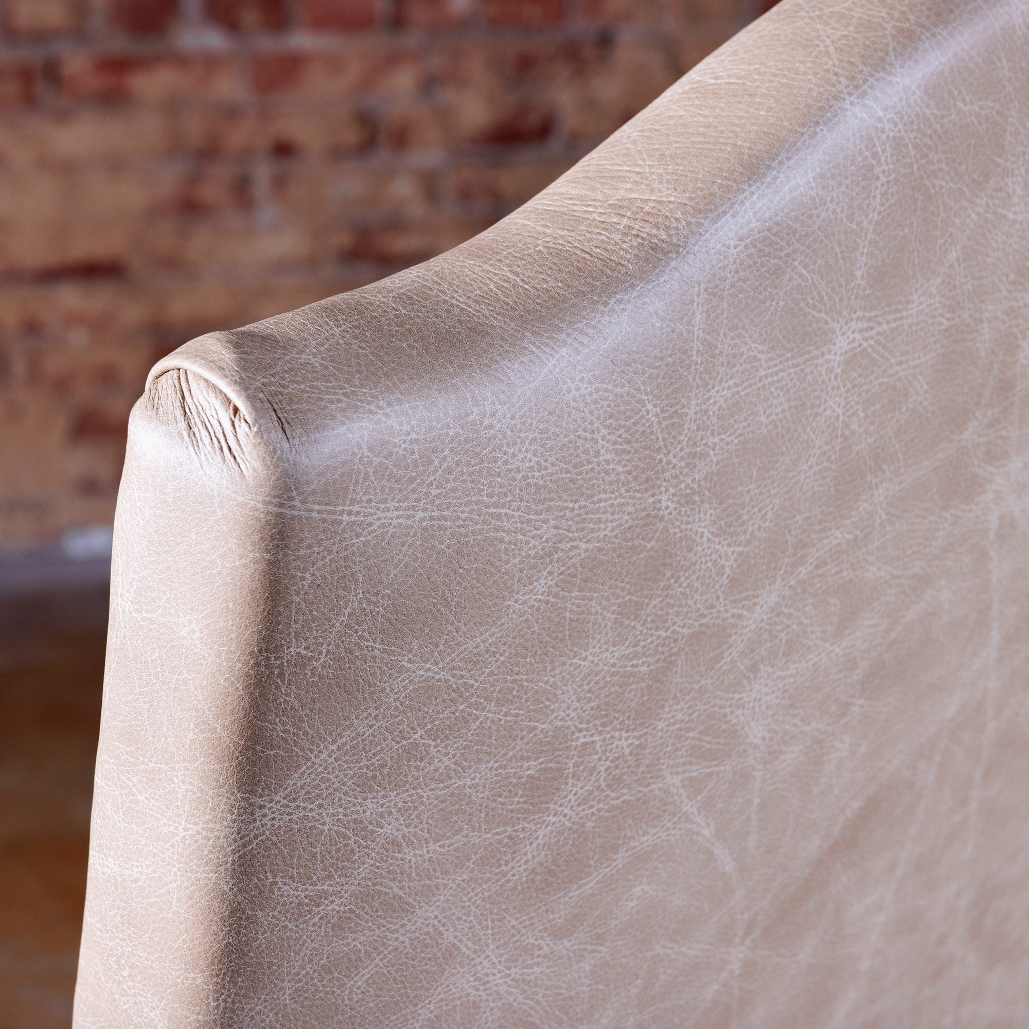Detail of premium top-grain leather upholstery on Western dining chair