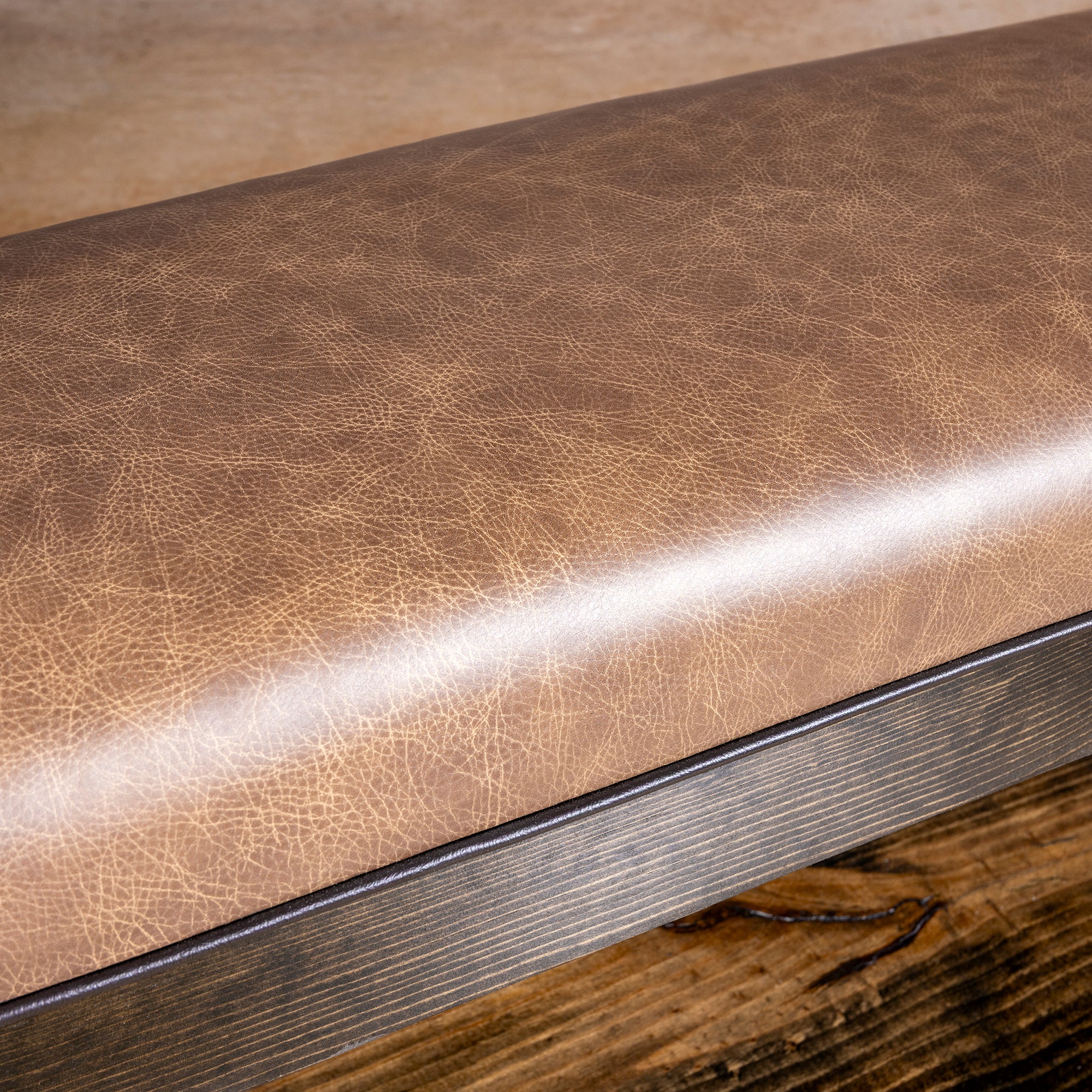 Tularosa Saddle Bench close detail of brown top-grain leather on a Western bench with rustic dark wood frame