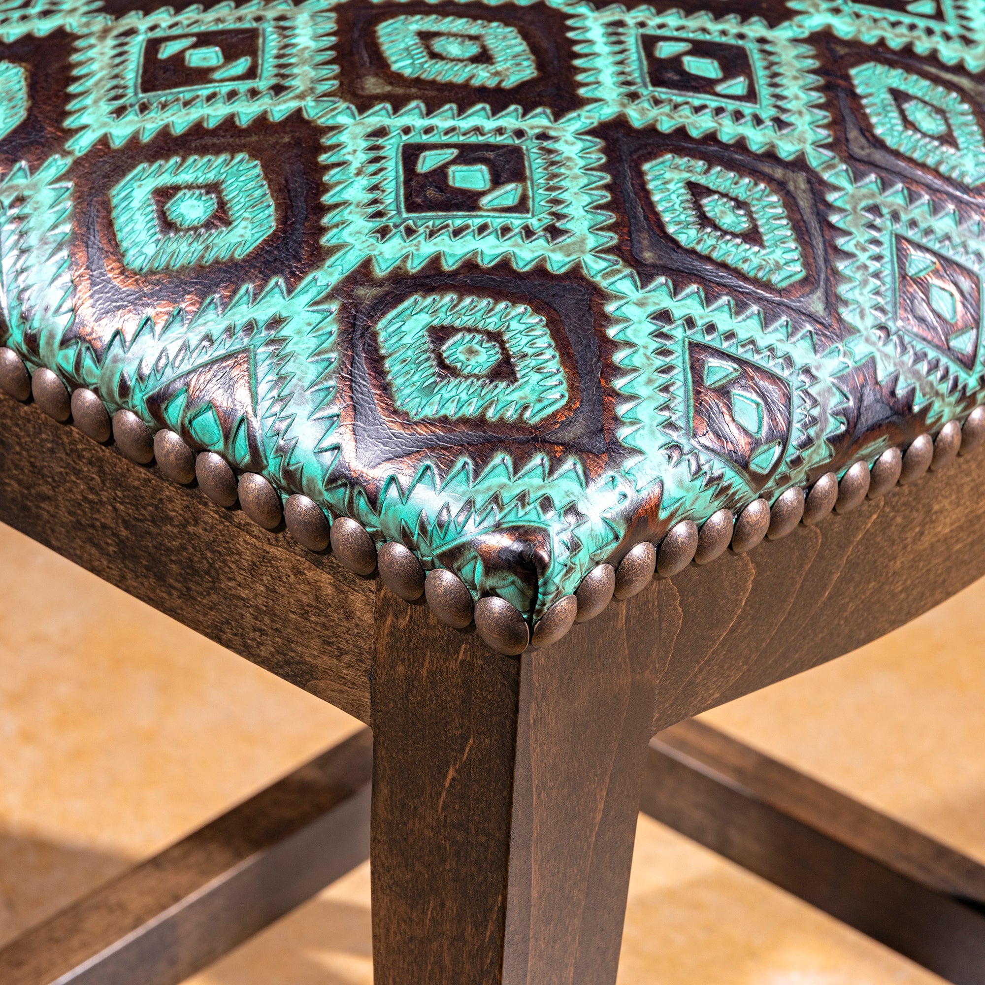 Verdigris Saddle Stool western bar stool with solid alder wood base, backless seat, and turquoise tooled leather