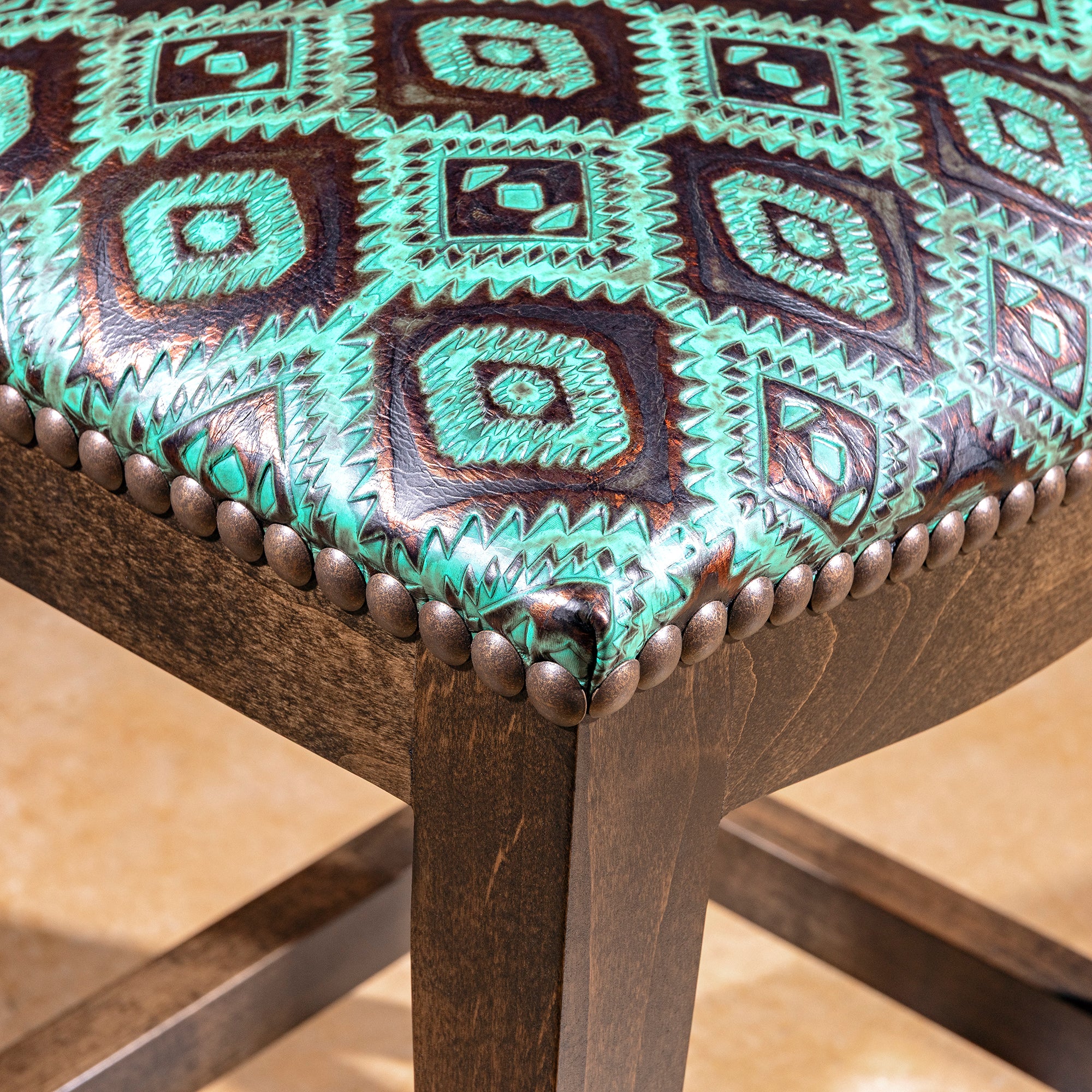 Verdigris Saddle Stool western bar stool with solid alder wood base, backless seat, and turquoise tooled leather