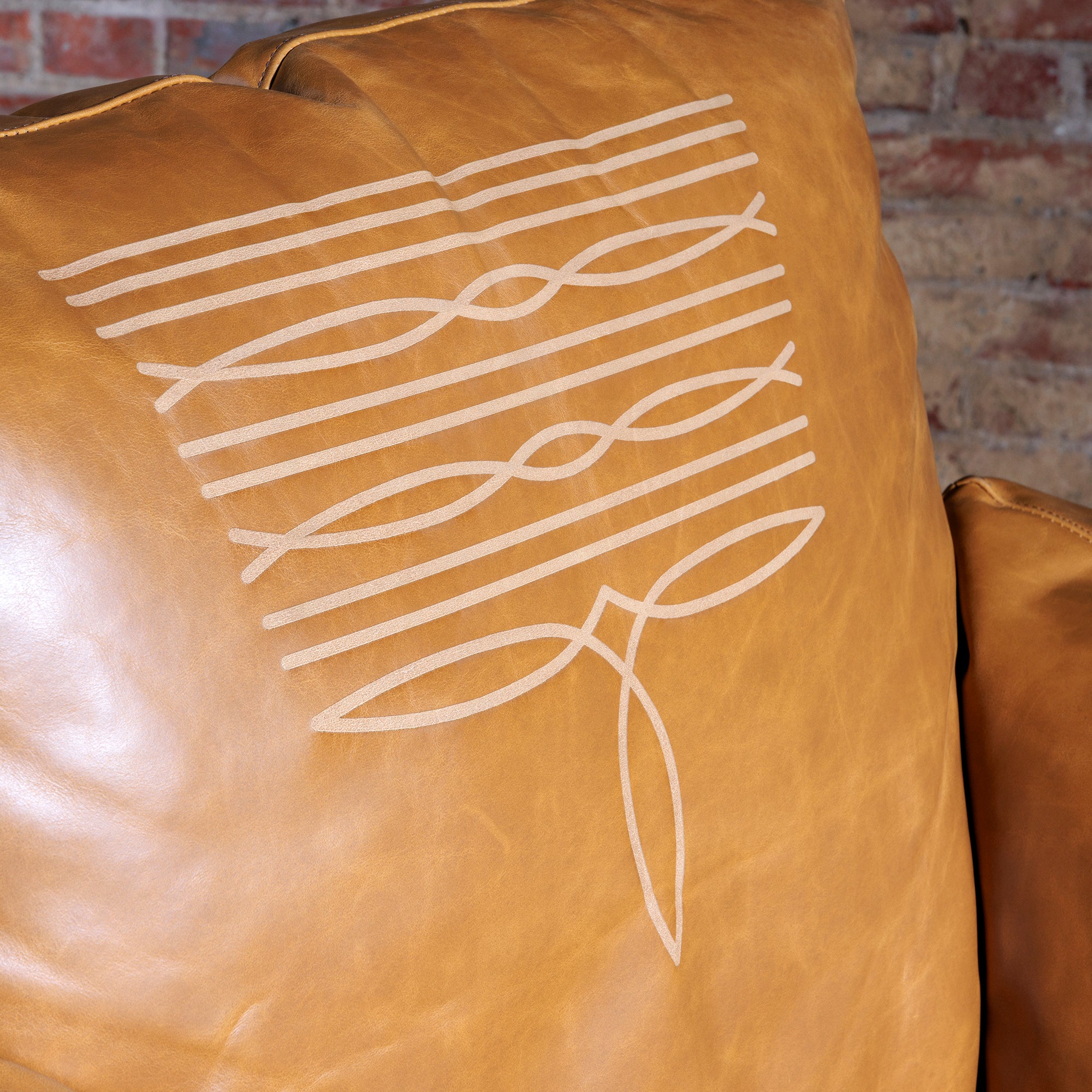 Close-up of contrast boot stitching on Western leather recliner