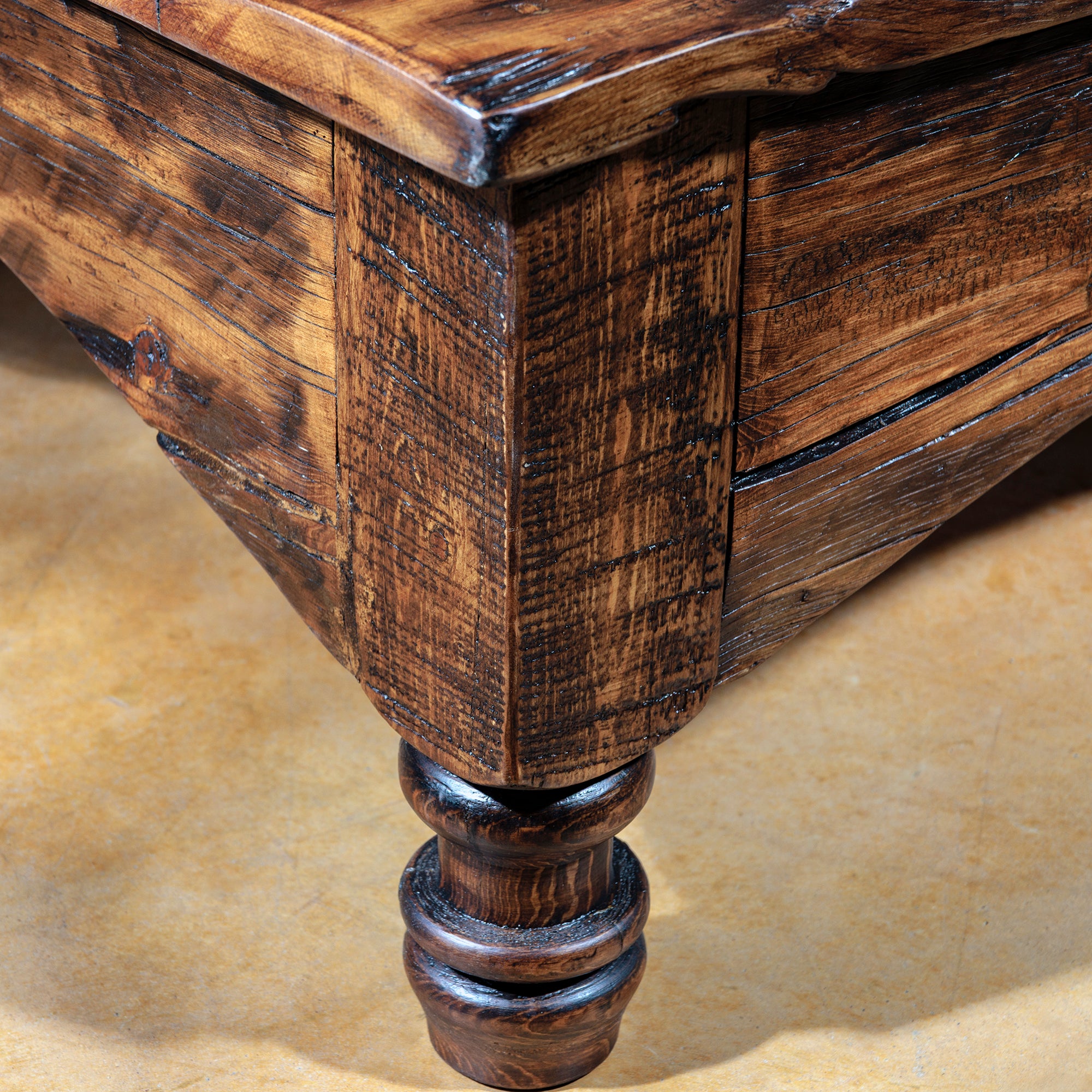 Rustic reclaimed wood coffee table with smooth curved apron