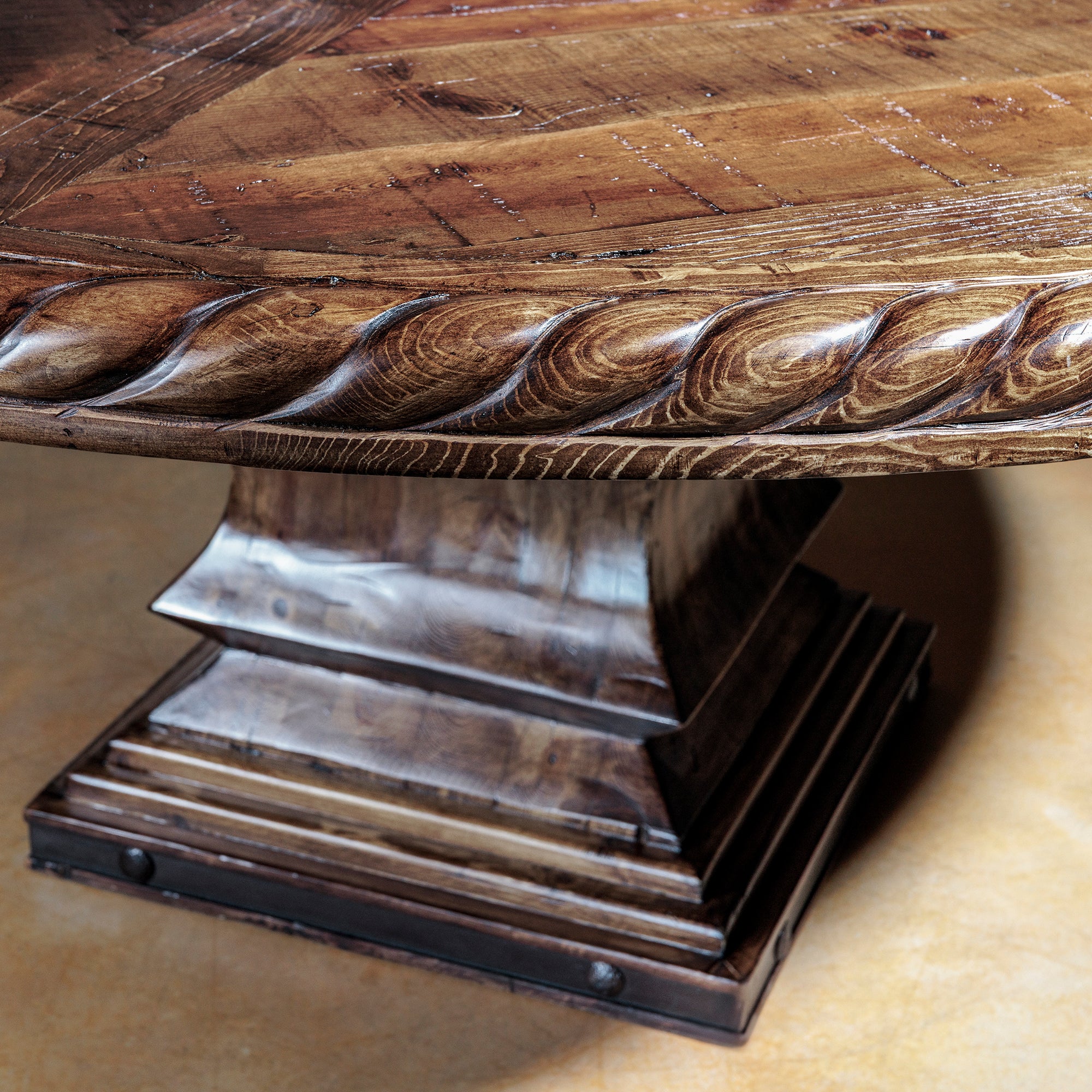 Solid wood pedestal base of Western dining table with rich finish