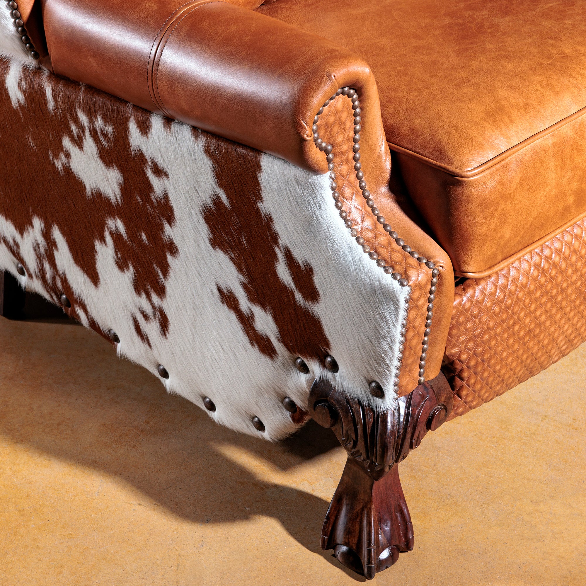 Detail view of the western leather cowhide recliner foot detail alt 2