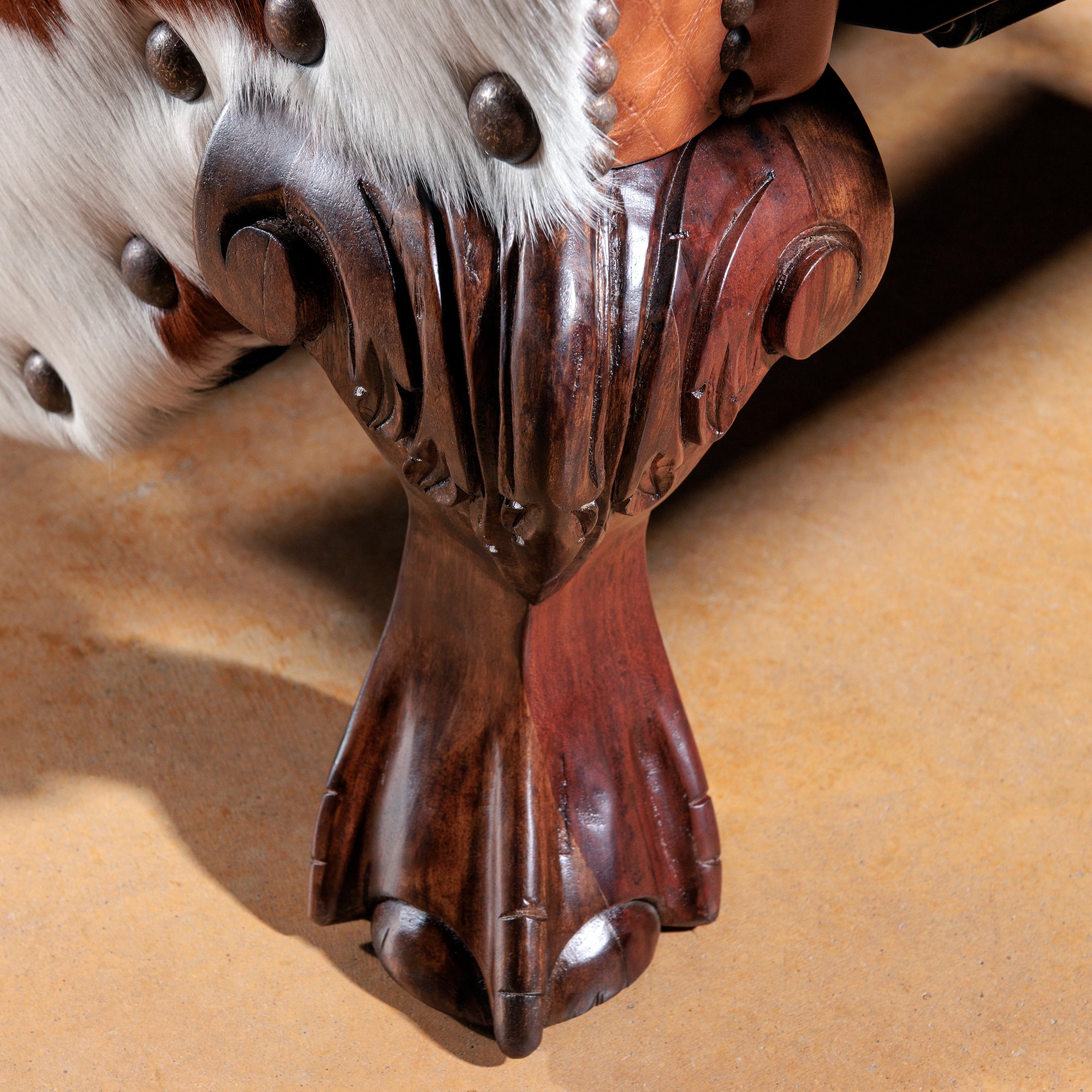 Detail view of the western leather cowhide recliner foot detail