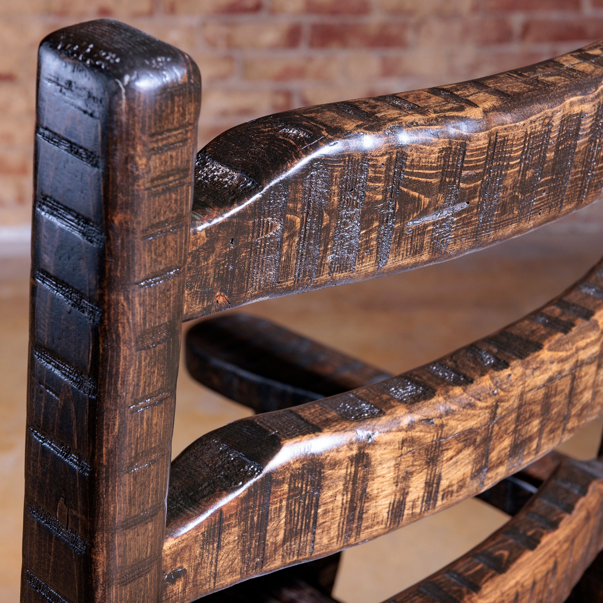 Close-up of hand carved wood ladderback detail on Legacy Ladderback Arm Chair