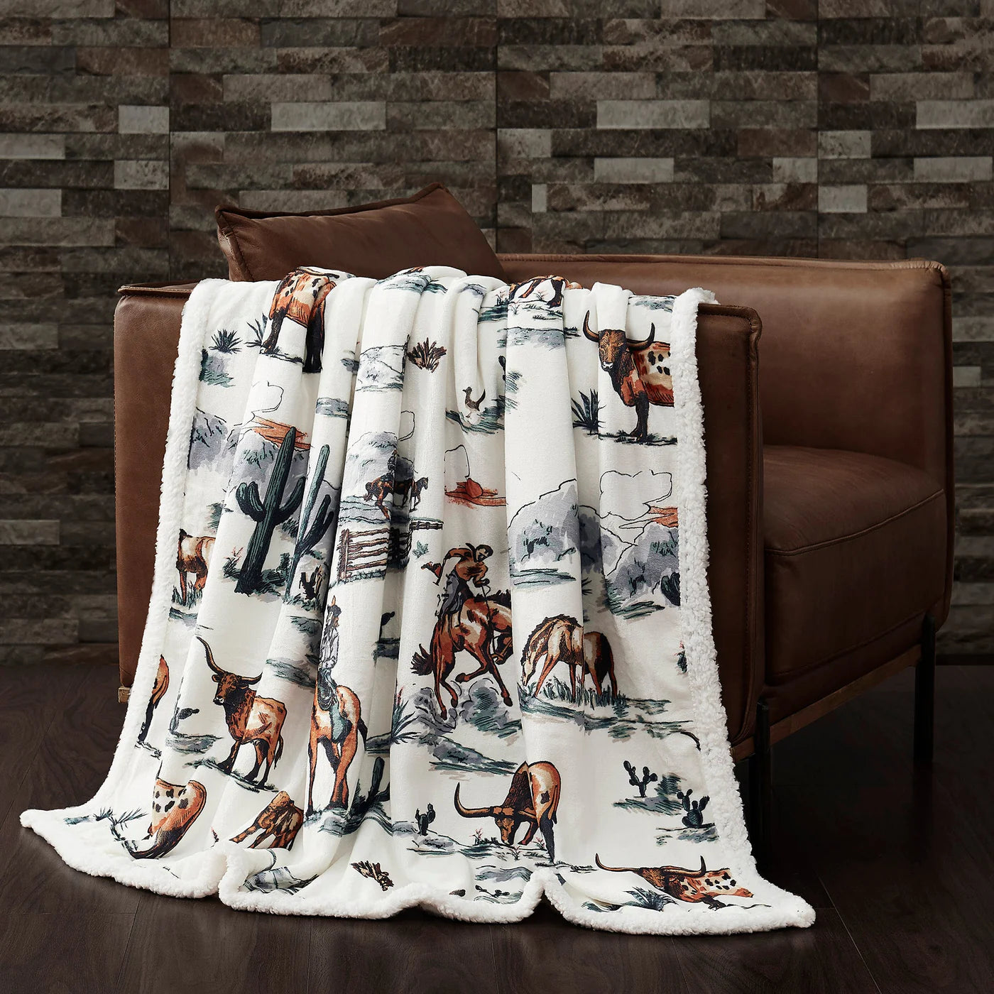 Stay warm with the Western Toile Campfire Throw. Its stylish Western-inspired design features scenes from the west, a plush sherpa reverse, and easy-care lightweight fabric ideal for any occasion. Wrap yourself in cozy comfort that won't break the bank.