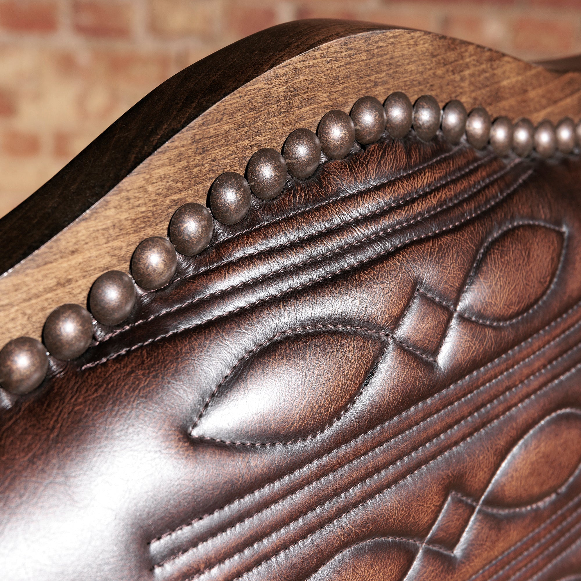 Luxury Western dining room with comfortable upholstered leather dining chairs, proper table spacing, supportive chair backs, and heirloom ranch style