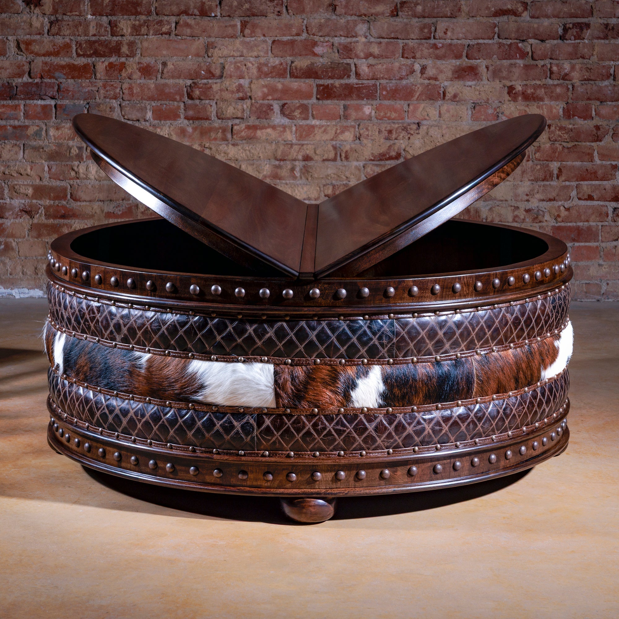 Handcrafted leather and cowhide ottoman with rustic wood base – luxury Western style