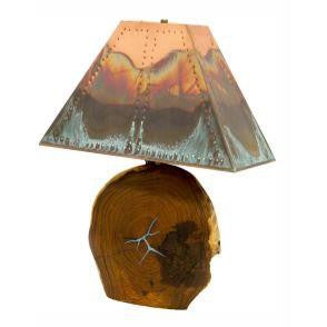 This stunning Mesquite Lamp with Copper Lampshade is crafted from authentic mesquite wood with beautiful turquoise inlay and a classic copper lampshade. This lamp will add a unique touch to your home decor.