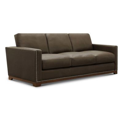 Brown leather sofa with nailhead trim and straight arms