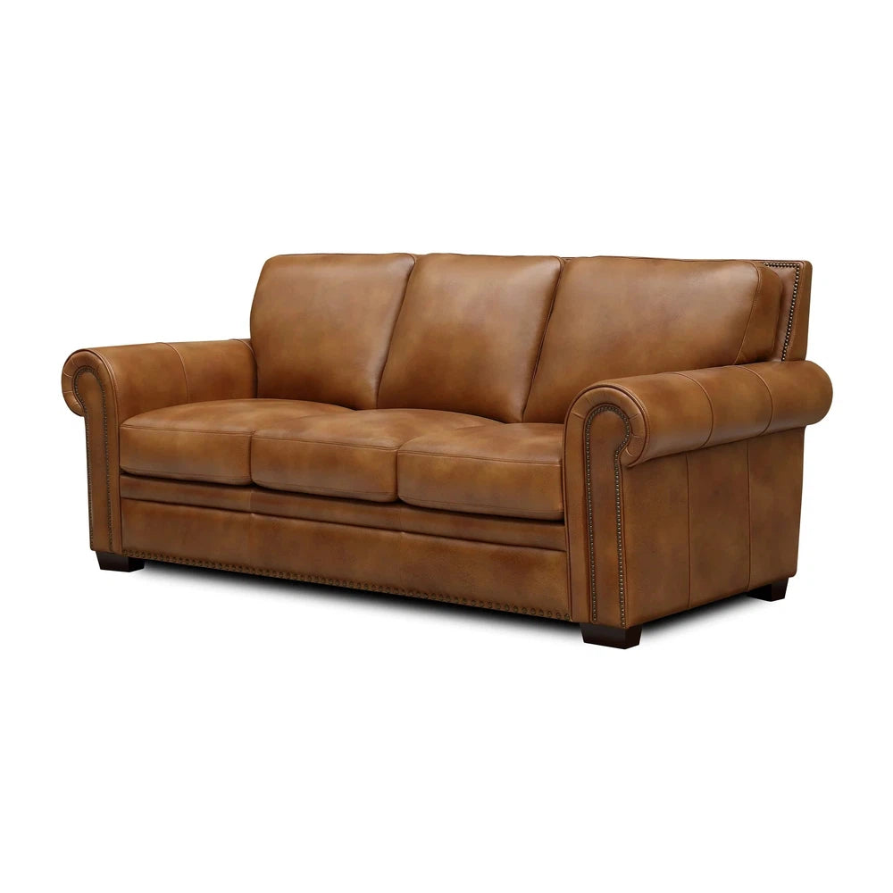 This luxurious Aledo Sofa and loveseat features a sturdy hardwood frame, pocketed coil seating for comfort, rolled arms, and a beautiful nailhead accent. The outside arms and outside back are fulled padded and reinforced. Upholstered in supple top grain leather all over, its design is suitable for both western and contemporary decor. Experience sumptuous comfort with the Aledo Sofa.