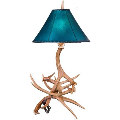 This rustic antler table lamp adds a unique addition to your home decor. Made from natural antlers, it exudes a timeless elegance unlike any other piece of furniture. With its warm glow, it's sure to become a beloved centerpiece in your room.