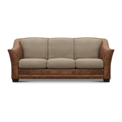 Two-tone sofa with beige cushions and brown leather accents