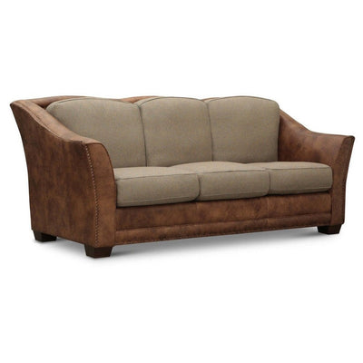 Two-tone sofa with beige cushions and brown leather accents