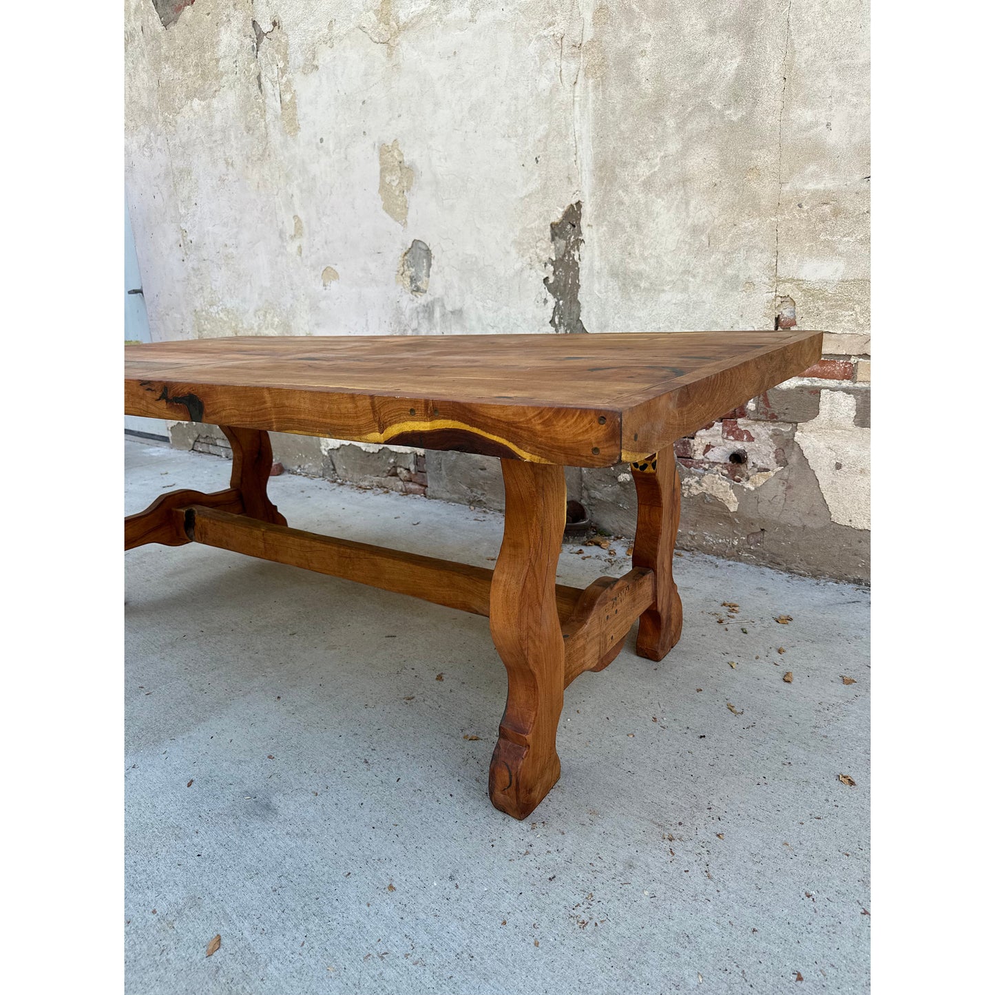 Our stunning Mesquite Dining Table features solid mesquite wood with a natural finish for a look of rustic elegance. The unique ox yoke leg design creates a look unlike any other, while custom sizing is available to fit your specific needs.