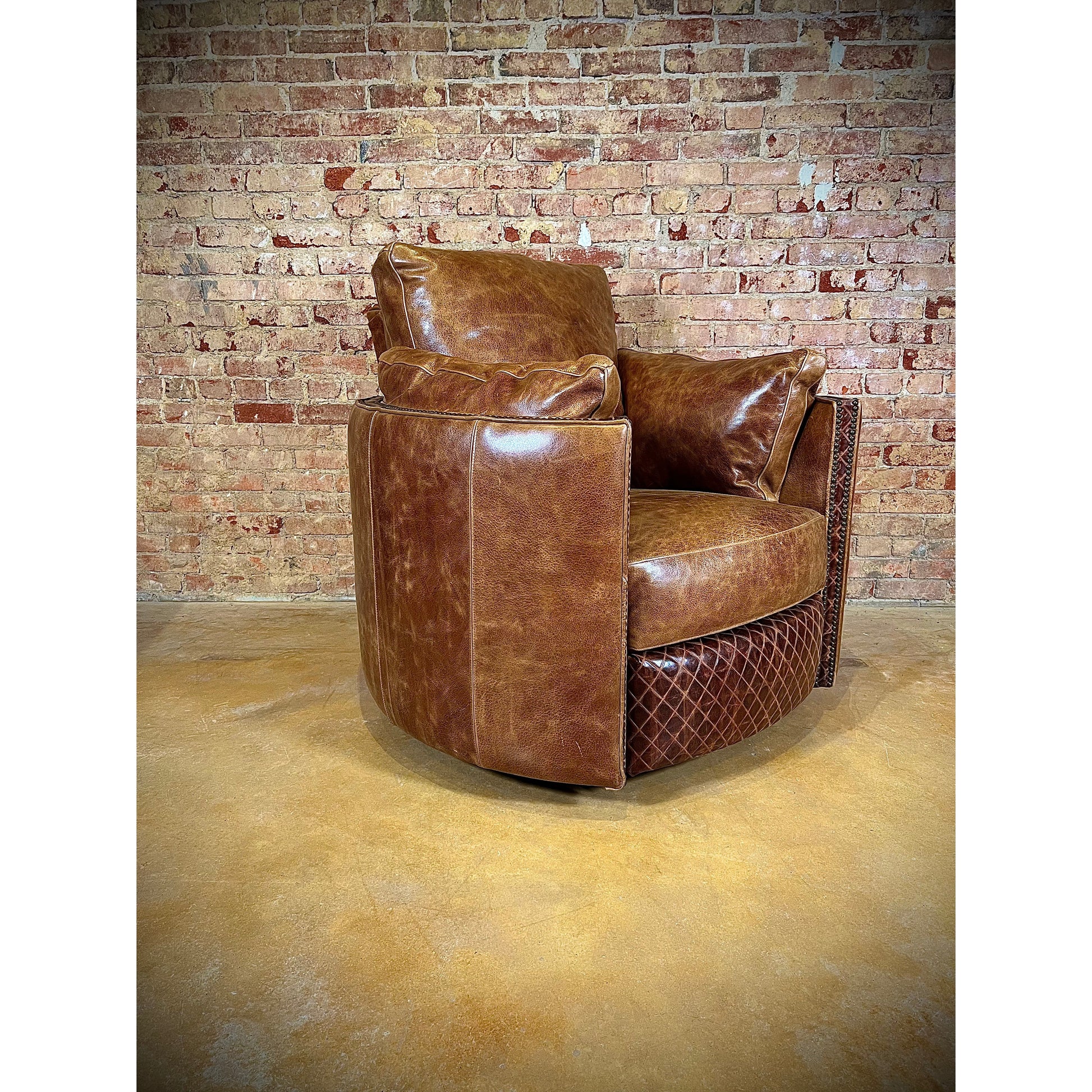 Experience ultimate comfort with our Cuddler Recliner. Made with top grain leather, our swivel chair not only provides luxurious relaxation but also cuddles your body for added support. Stay comfortable and cozy with this ultimate recliner.  You are able to customize the leathers to create the perfect piece for your space.