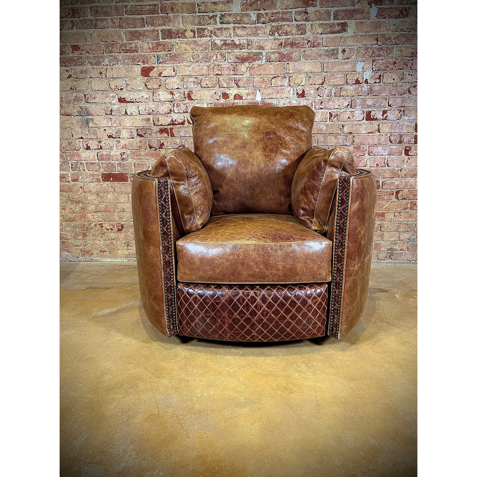 Experience ultimate comfort with our Cuddler Recliner. Made with top grain leather, our swivel chair not only provides luxurious relaxation but also cuddles your body for added support. Stay comfortable and cozy with this ultimate recliner.  You are able to customize the leathers to create the perfect piece for your space.