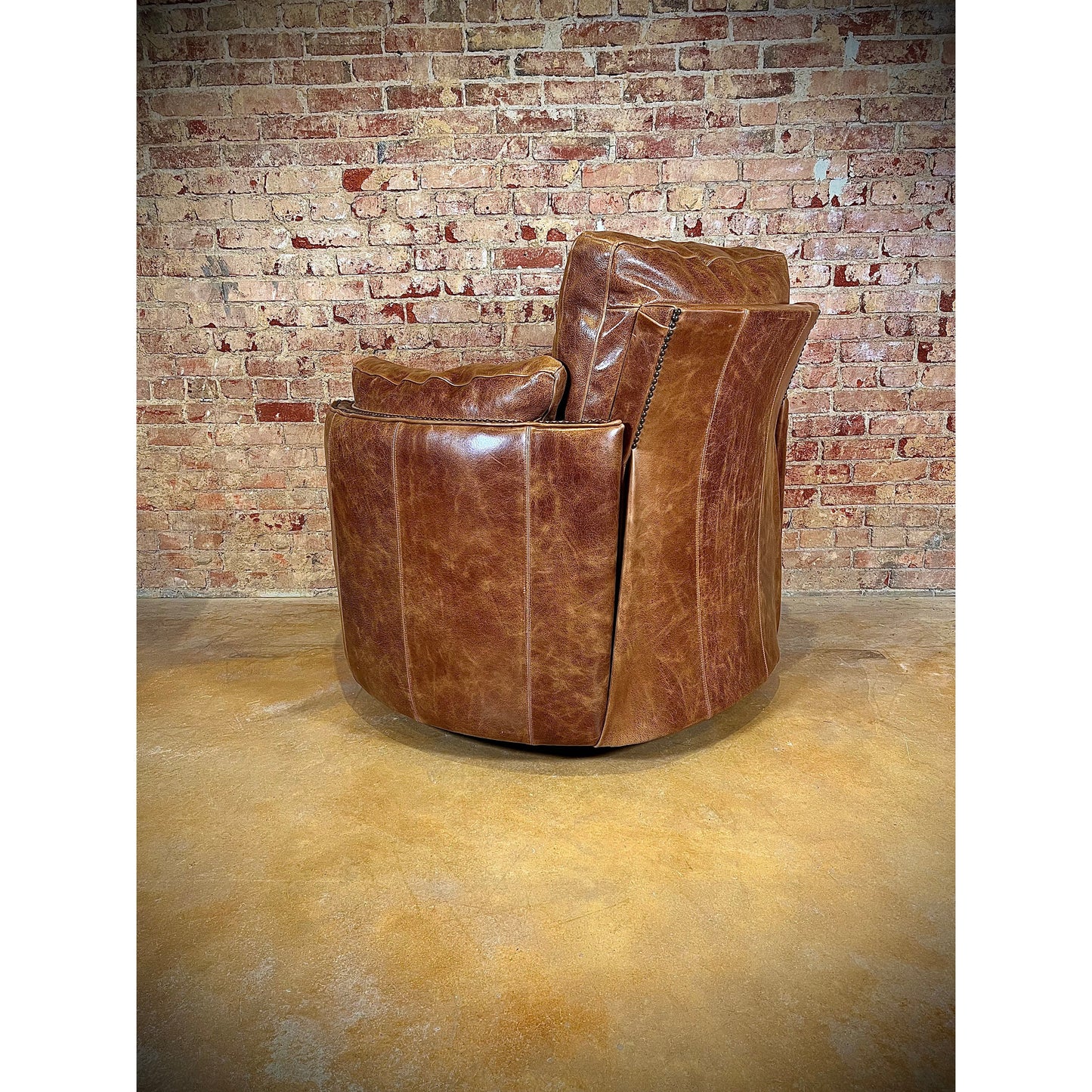 Experience ultimate comfort with our Cuddler Recliner. Made with top grain leather, our swivel chair not only provides luxurious relaxation but also cuddles your body for added support. Stay comfortable and cozy with this ultimate recliner.  You are able to customize the leathers to create the perfect piece for your space.