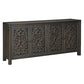 The Caprice Distressed Black 4 Door Console exudes expert craftsmanship with its hand-carved doors made of durable mango wood. This unique piece adds a touch of sophistication to any space, while providing ample storage space. Elevate your home decor with this stunning console.