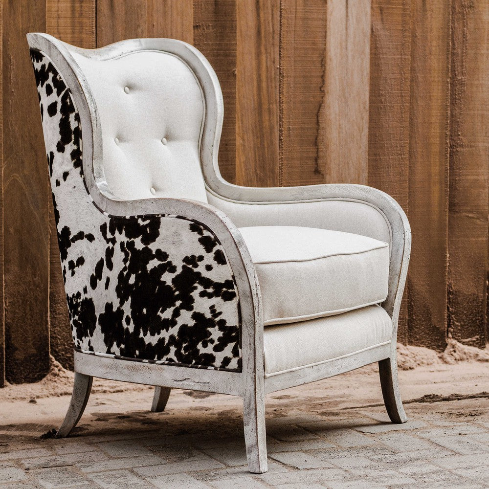 The Chalina Chair is a contemporary piece of art, blending modern design with classic features. Constructed with solid mahogany exposed wood in an aged bone-white finish and surrounding plush dark chocolate and milky white velvet upholstery, the chair boasts a comfortable 19" seat height and a soft linen box cushion. Perfect for adding a touch of style to any room.