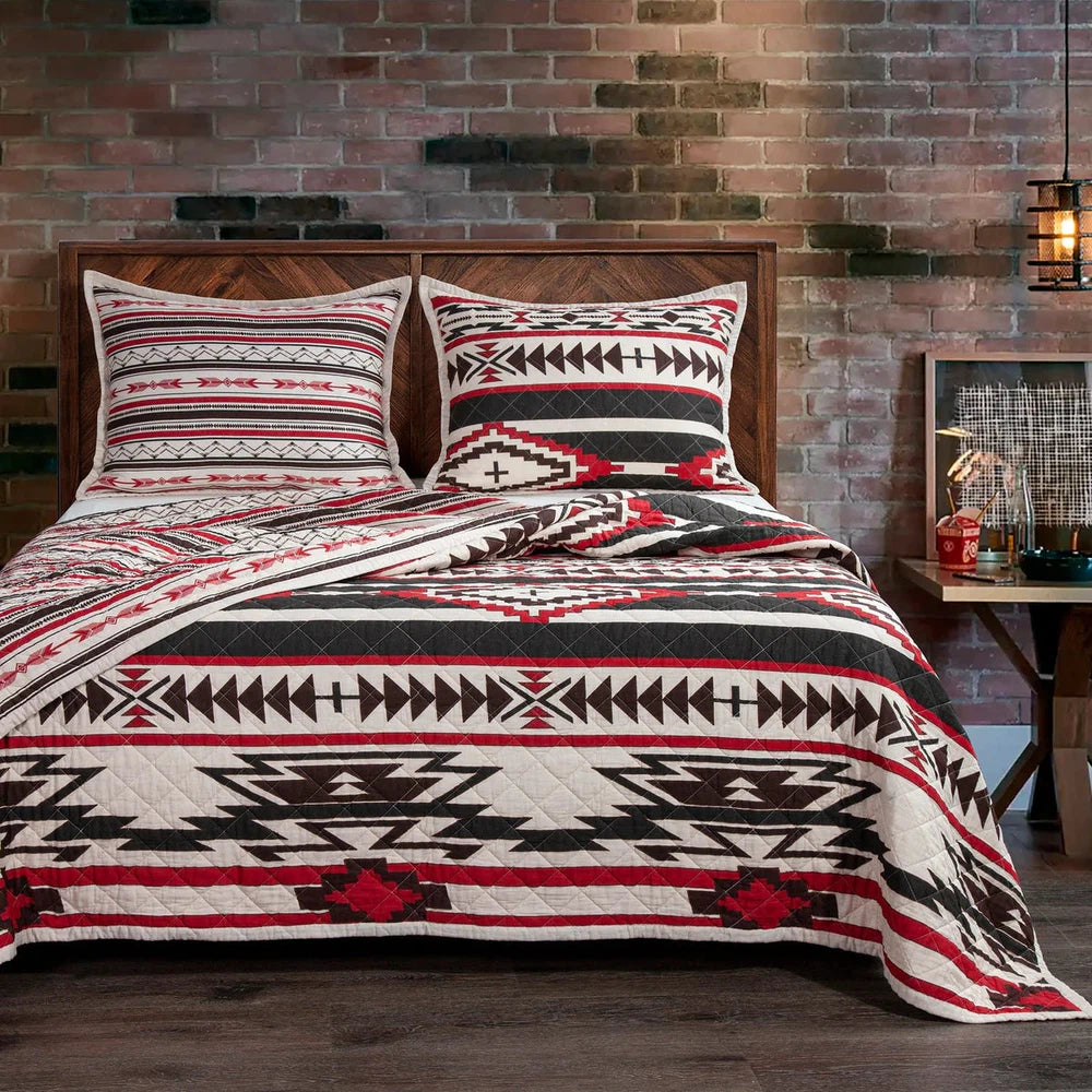 The Cortez Quilt Set is the perfect way to bring excitement to your bedroom. Inspired by iconic Western scenes, the bold crimson, black, and neutral tones create a vivid geometric pattern that stands out against any decor. Crafted with soft cotton filling, you can relax in comfort while still experiencing a splash of adventure. Reversible for easy transitioning, refresh your sleeping space with a simple flip of the quilt.