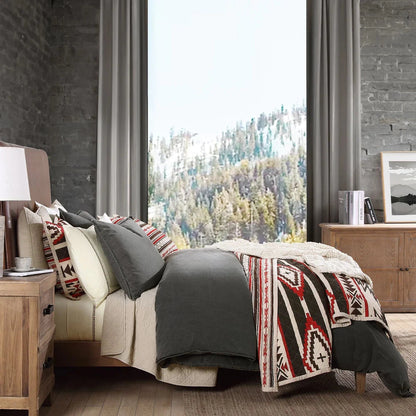 The Cortez Quilt Set is the perfect way to bring excitement to your bedroom. Inspired by iconic Western scenes, the bold crimson, black, and neutral tones create a vivid geometric pattern that stands out against any decor. Crafted with soft cotton filling, you can relax in comfort while still experiencing a splash of adventure. Reversible for easy transitioning, refresh your sleeping space with a simple flip of the quilt.