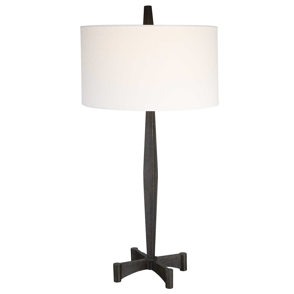 This classic metalwork inspired table lamp is perfect for any industrial decor. Constructed with a tapered base and aged black finish, its subtle rust distressing adds an authentic vintage touch. Enjoy the perfect ambiance when you turn on the Counteract Table Lamp.