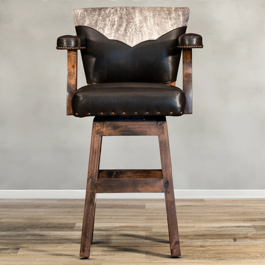 Experience the rustic elegance of our Cowhide Yoke Chisum Barstool. With its top grain leather and cowhide yoke, this barstool adds a touch of comfort and sophistication to any space. The accent nails provide a stylish detail, making it the perfect addition to your home or workspace.