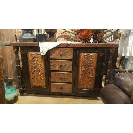 The Flora Buffet is a perfect choice for those looking to add a touch of rustic elegance to their home. Crafted from solid reclaimed wood and hand-carved, this sideboard or buffet is sure to bring a classic touch to any space.